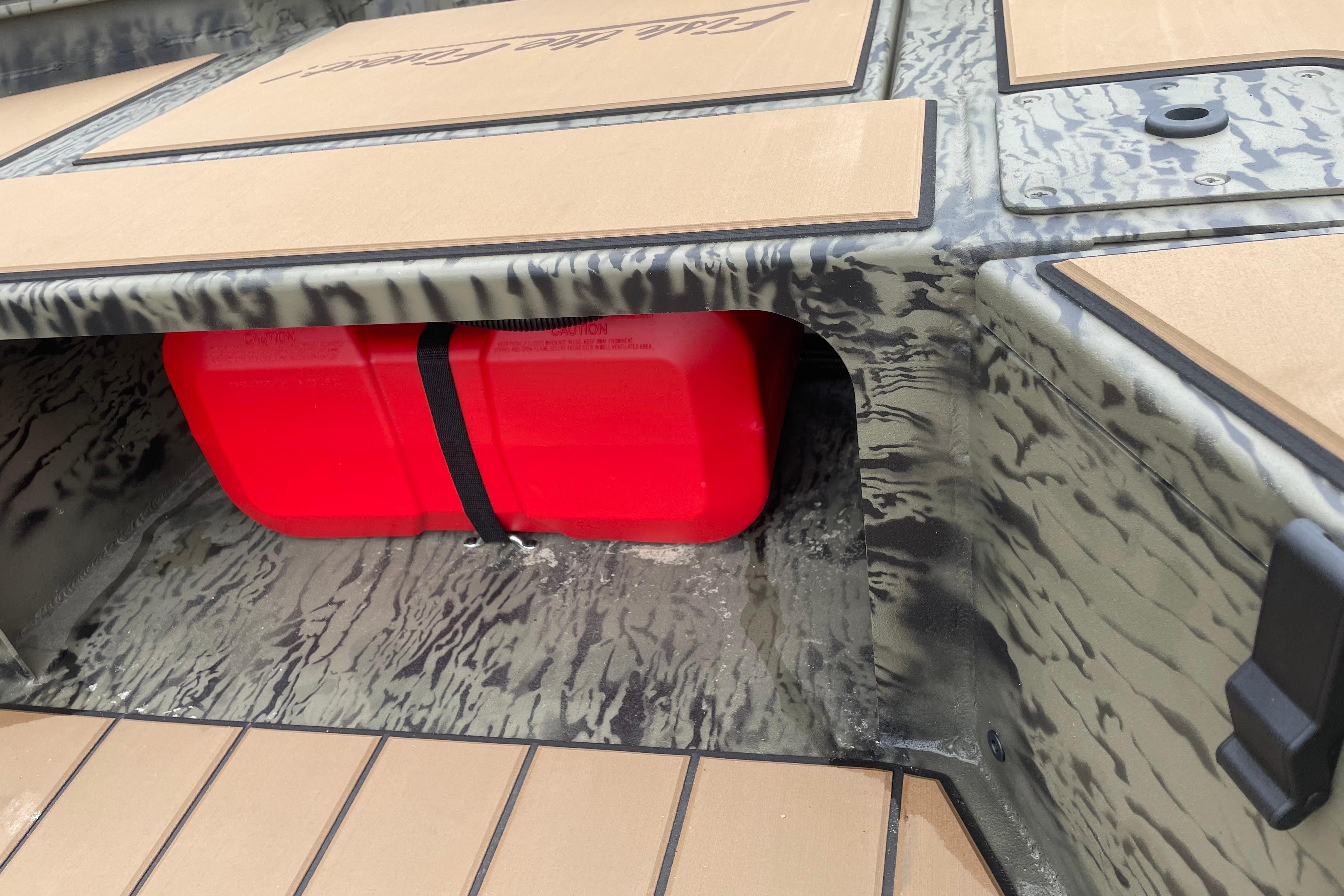 2026 Tracker Grizzly 1756 T Marsh boat with red fuel tank storage.