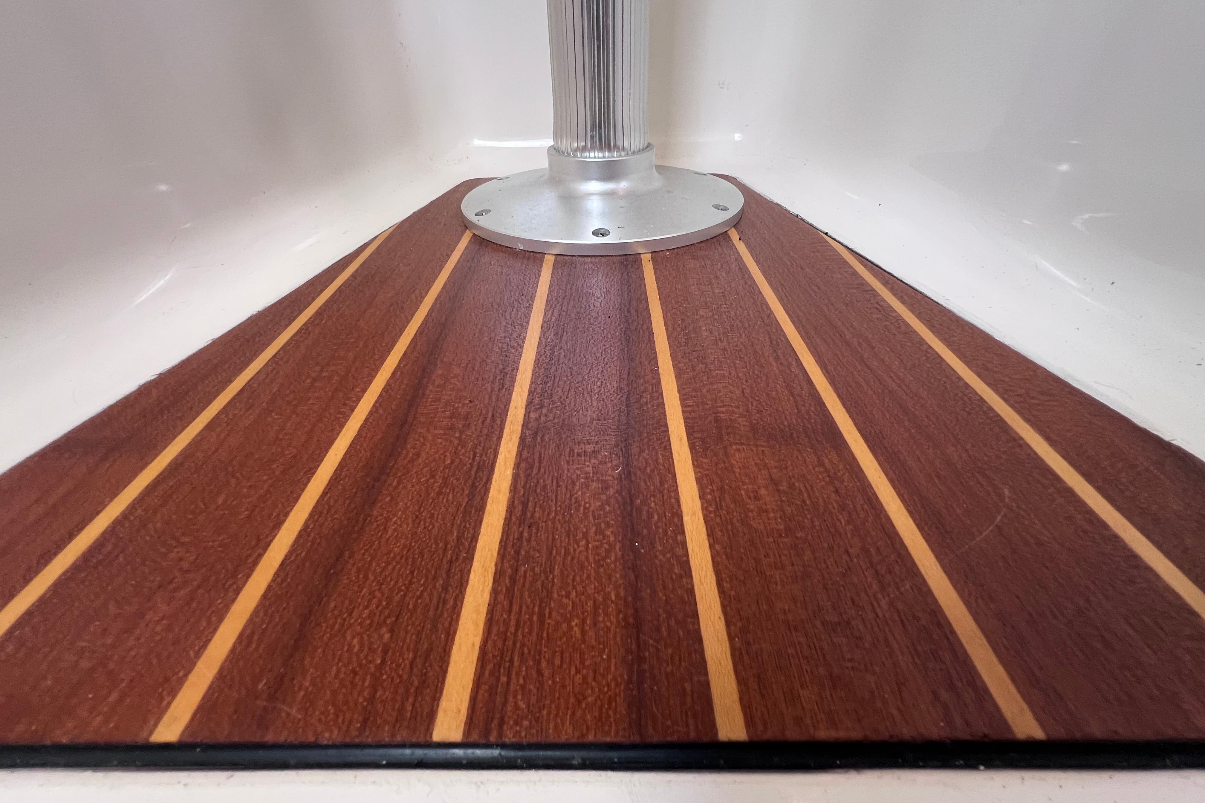 Teak flooring detail on 2004 Pursuit 2870 Walkaround boat interior.