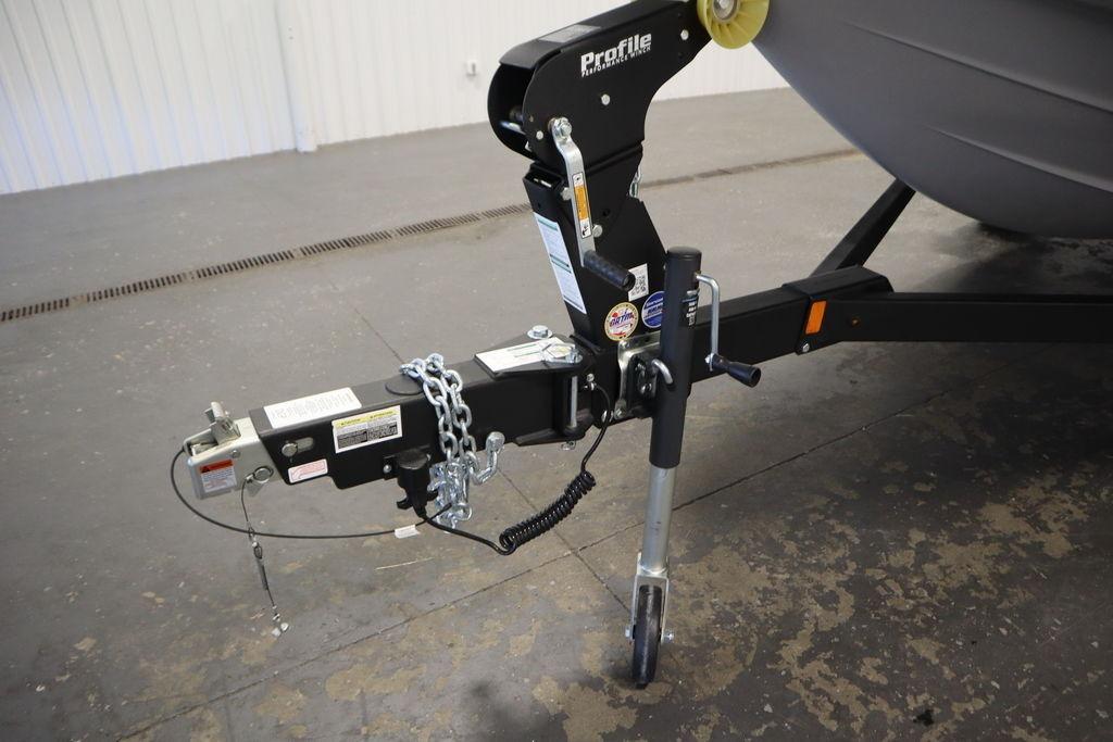 Trailer hitch of 2026 Yamaha Boats 195S with safety chains and jack stand.