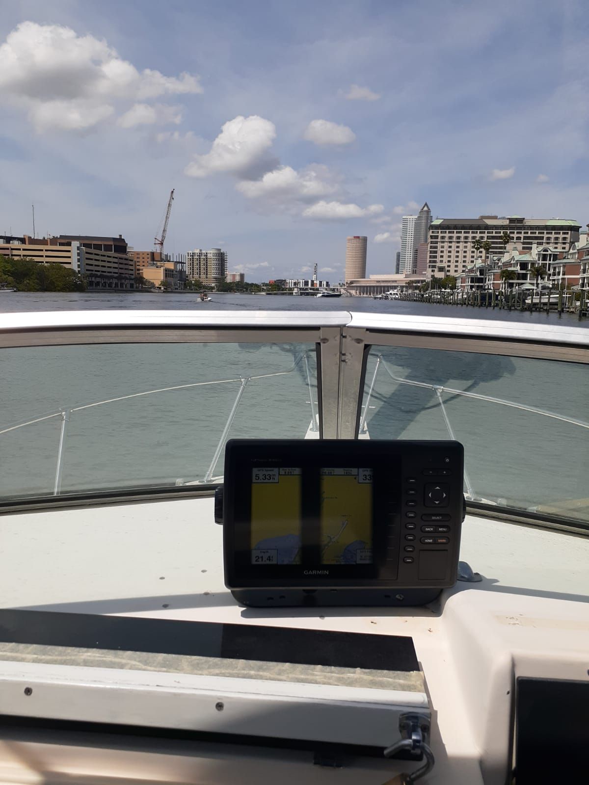 The image shows the cockpit of a 1995 Grady-White Explorer 24 with a navigation system.