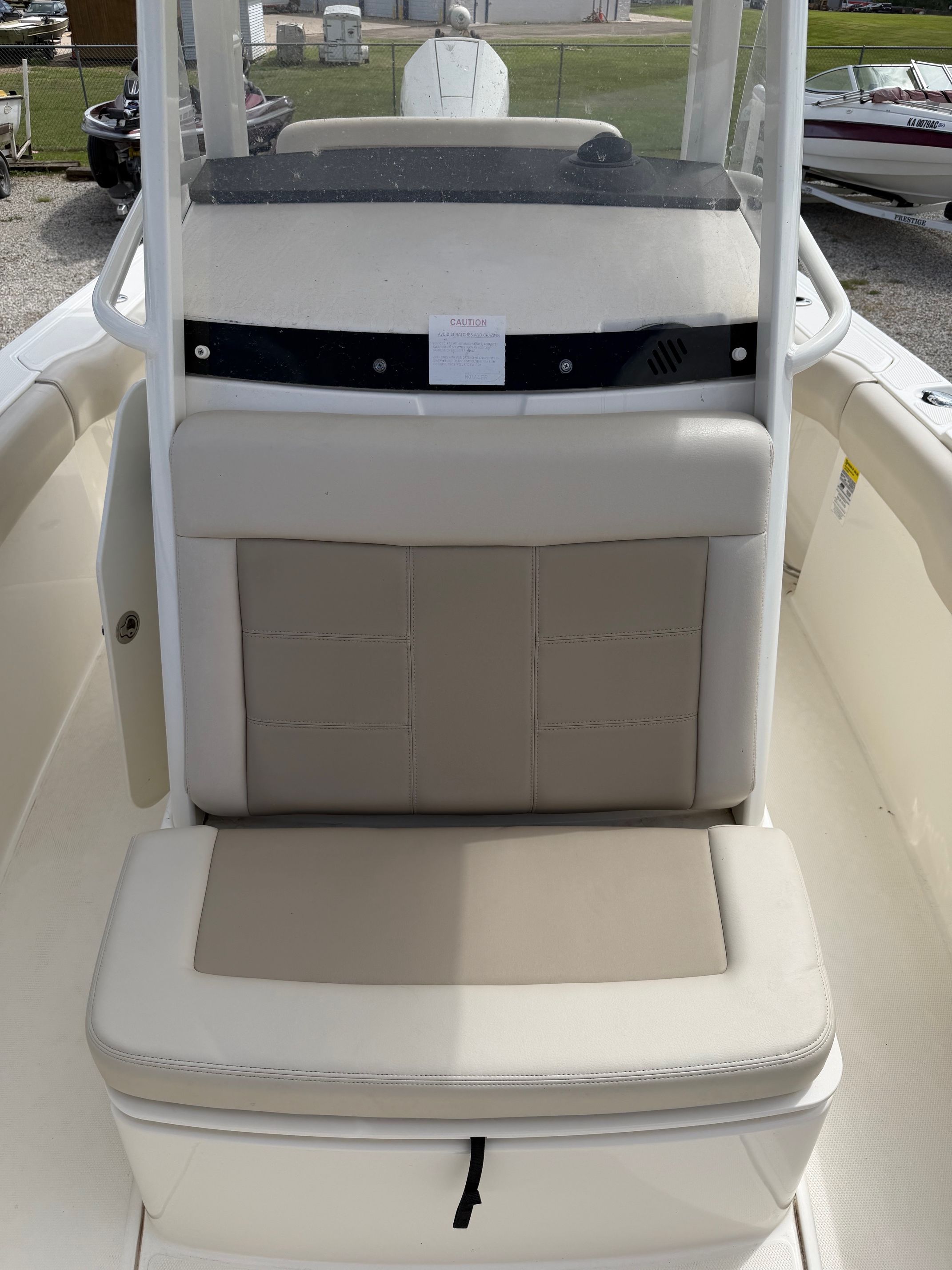 Boston Whaler 230 Outrage 2020 seating area with beige upholstery.