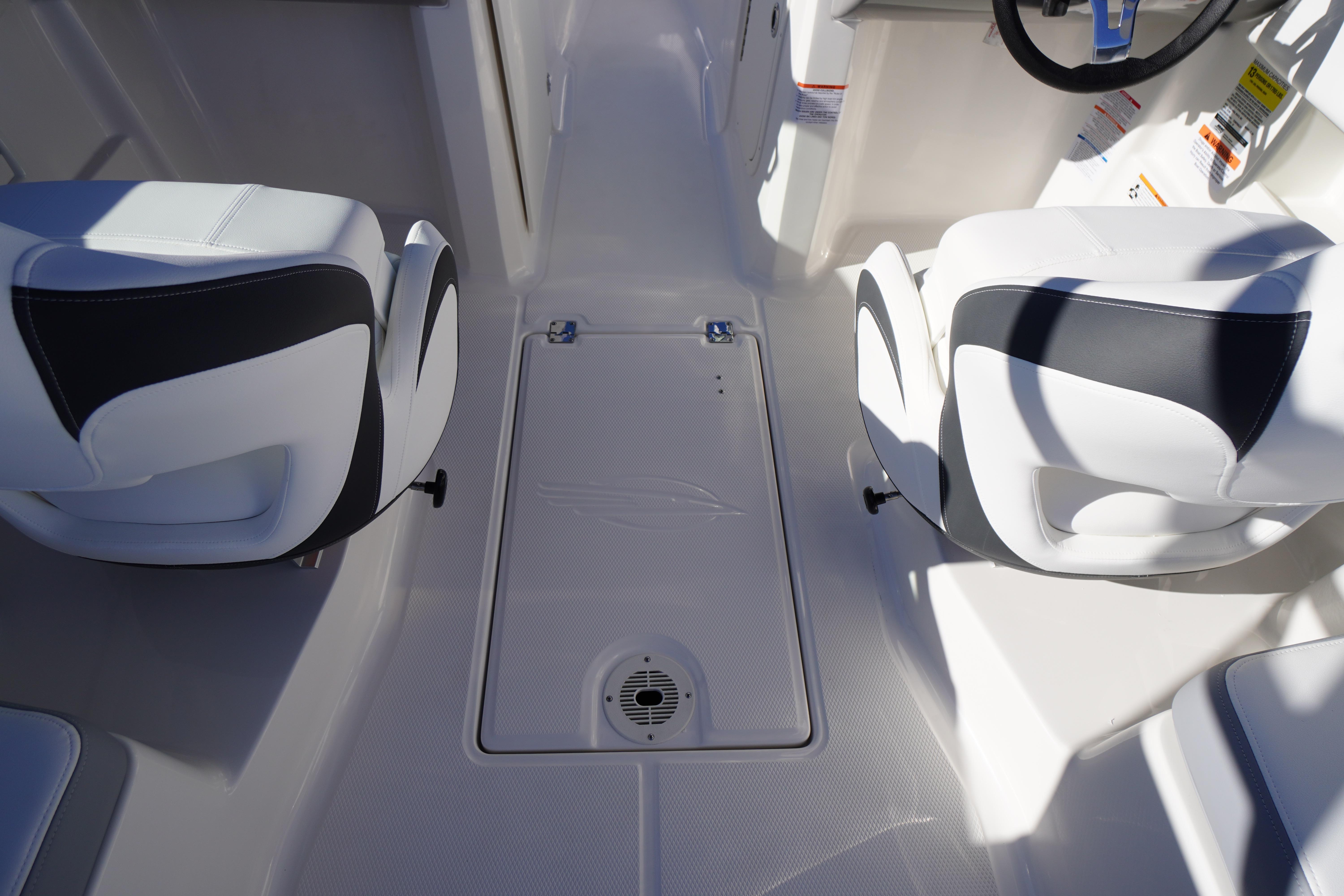 Interior of 2026 Chaparral 23 SSi boat with white and black seating.