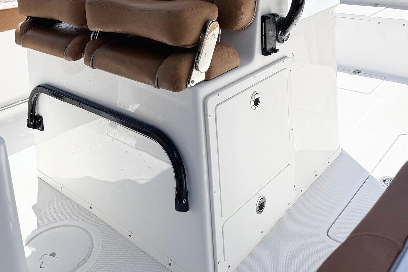 2026 Seahunt Ultra 305 CB boat interior with brown seating and storage compartments.