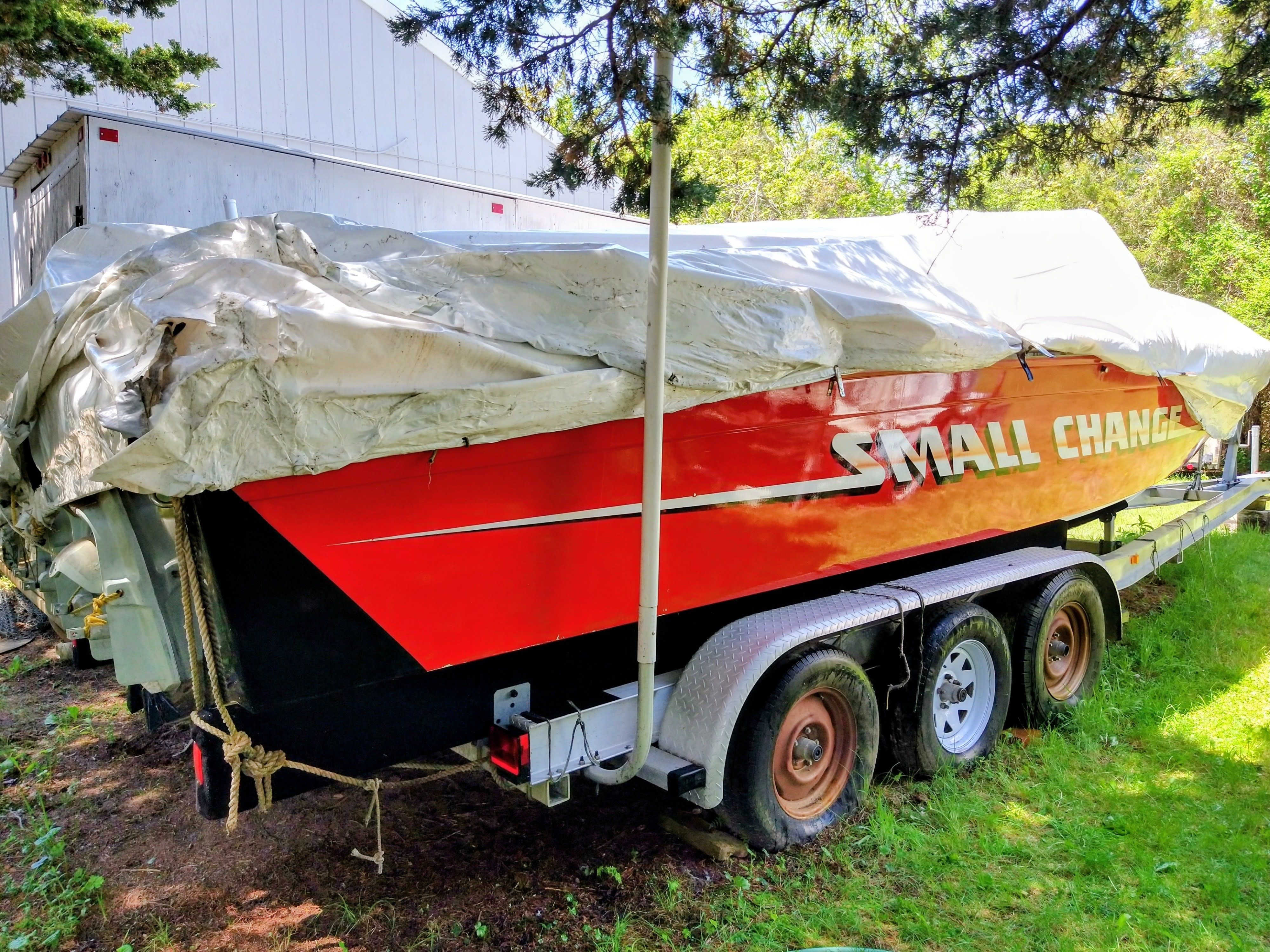 1986 Corsa Performance Boat covered on trailer.
