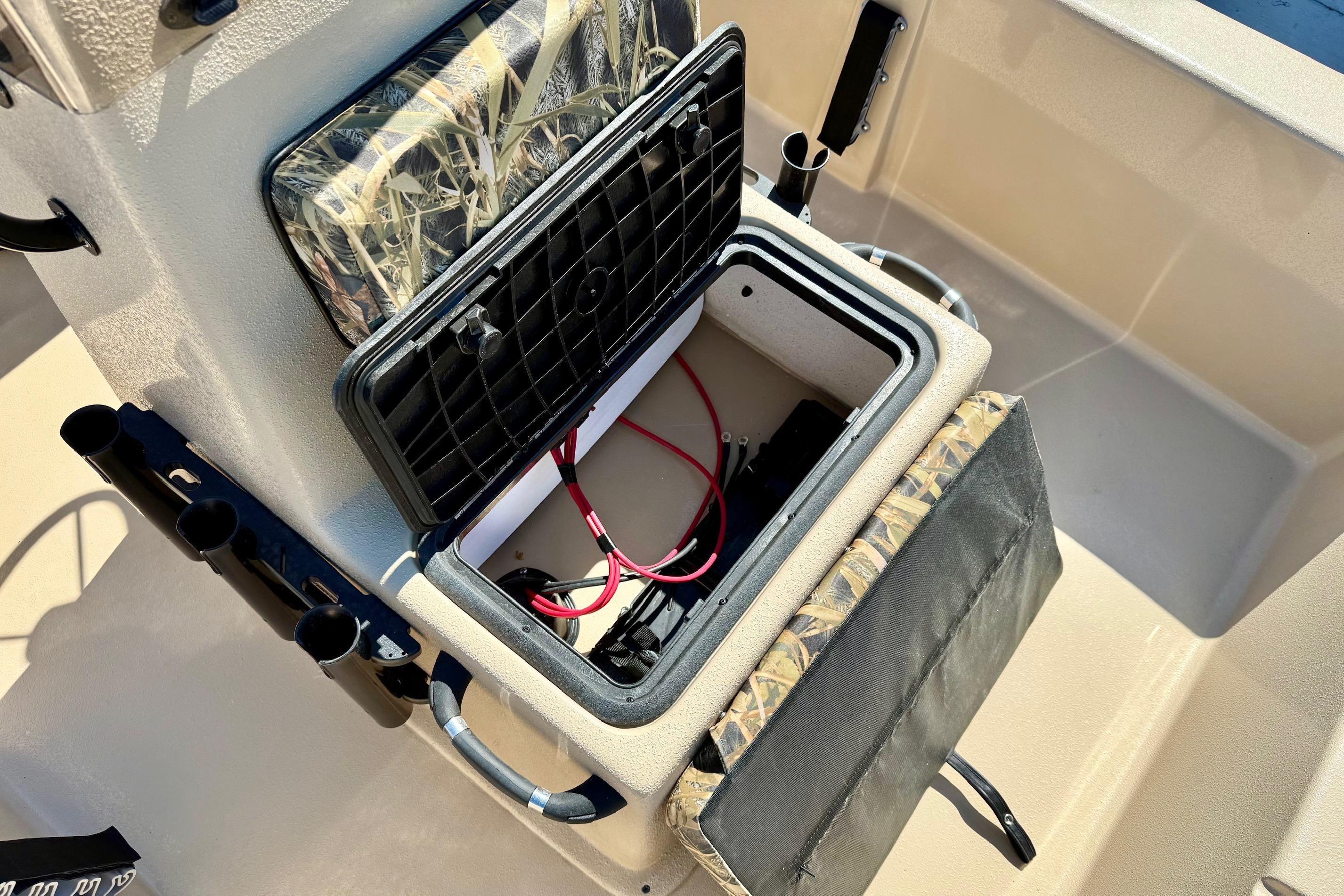 Open storage compartment in 2026 Carolina Skiff E18 JVX CC boat.