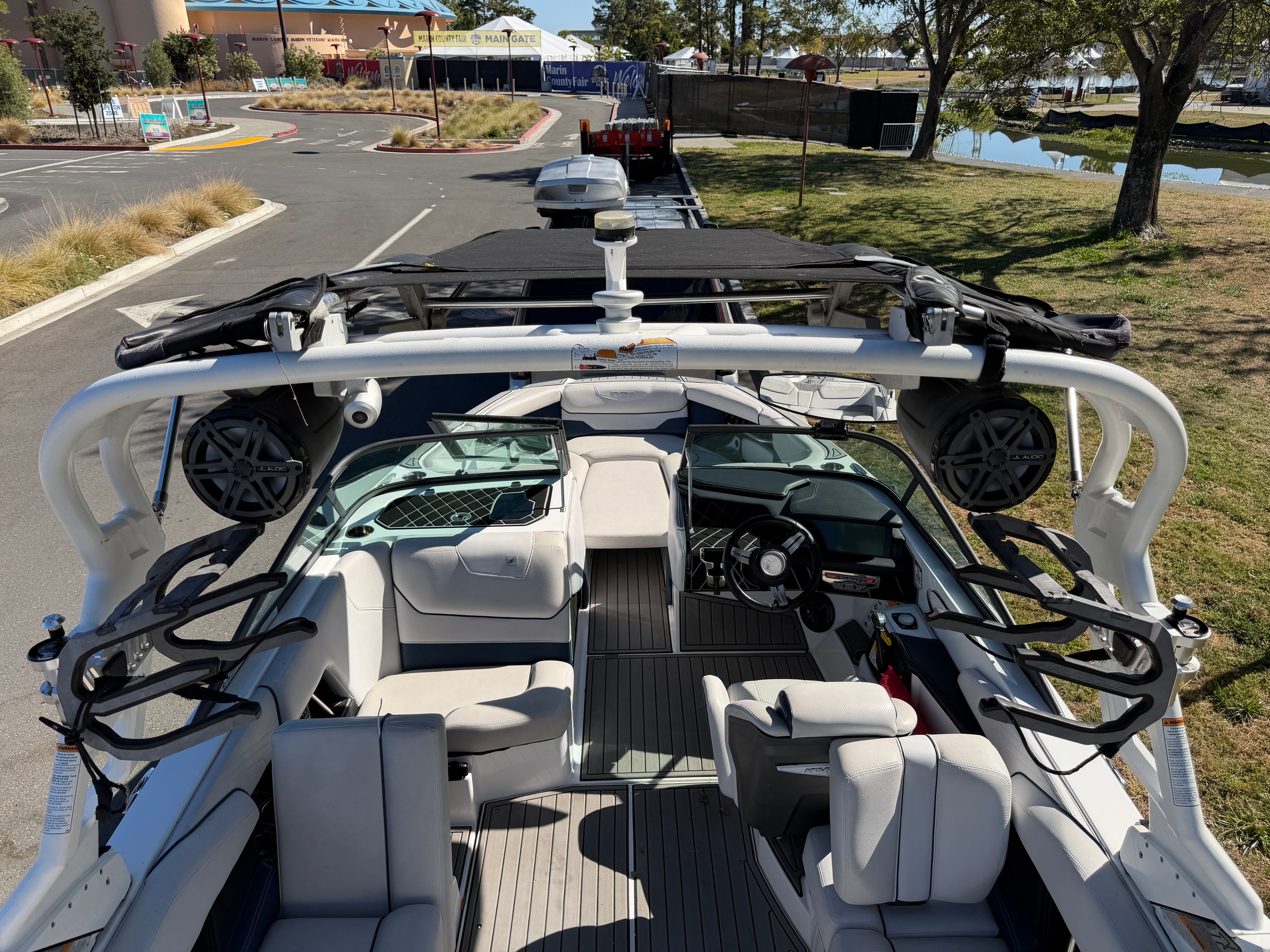 The image shows the interior of a 2018 Nautique Super Air Nautique GS22 with modern seating and speakers.
