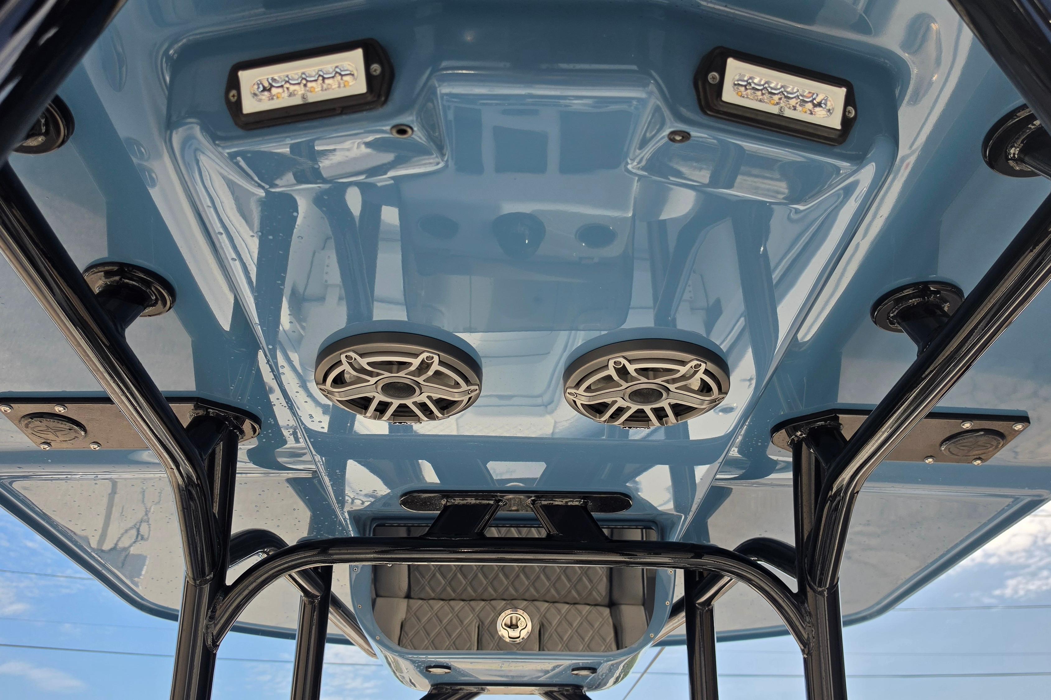 2025 Yellowfin 26 Hybrid boat interior with speakers and LED lights on the ceiling.