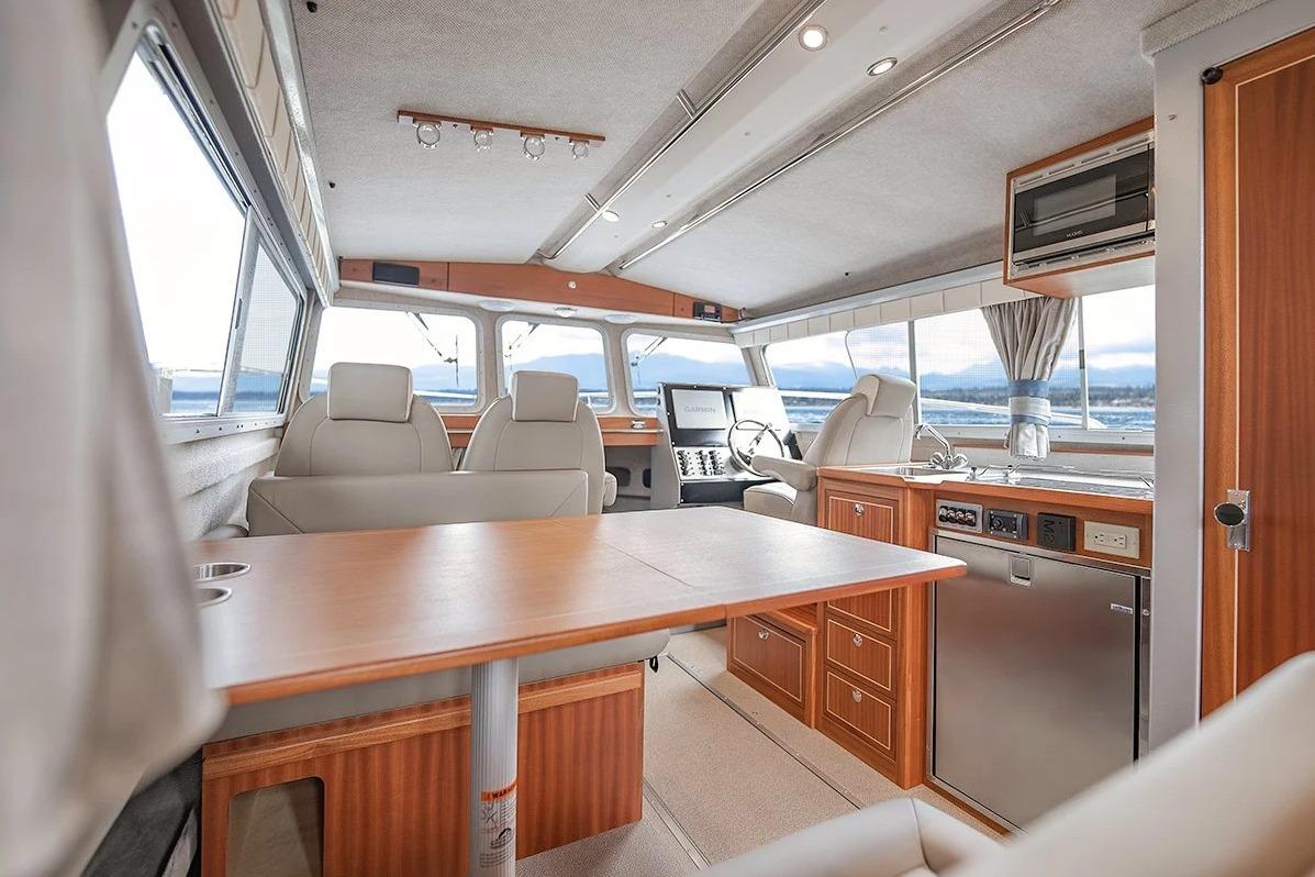 Luxurious interior of 2026 KingFisher 3225 GFX Offshore boat with modern amenities and seating.