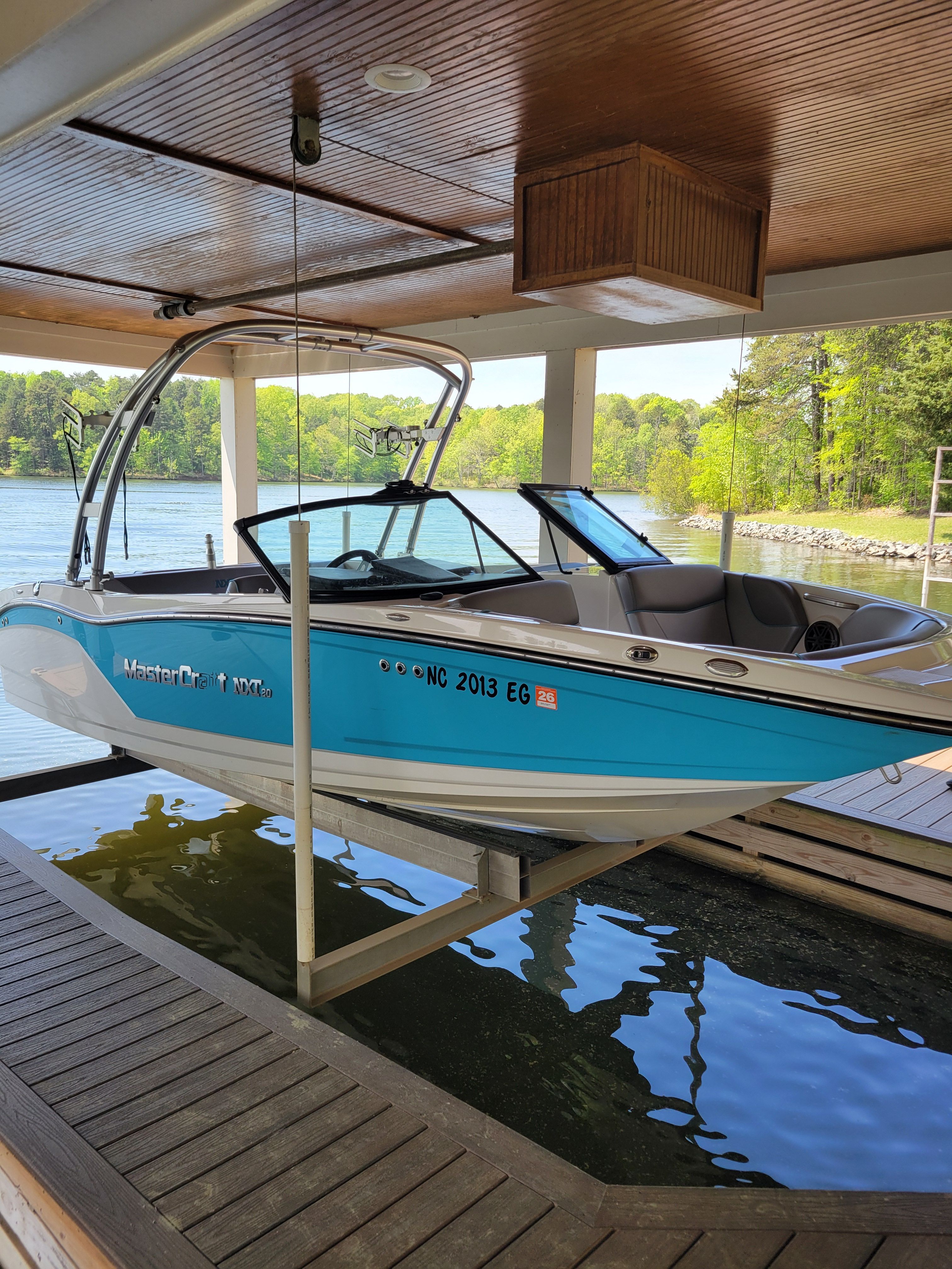 2017 MasterCraft NXT20 boat in a covered boathouse.