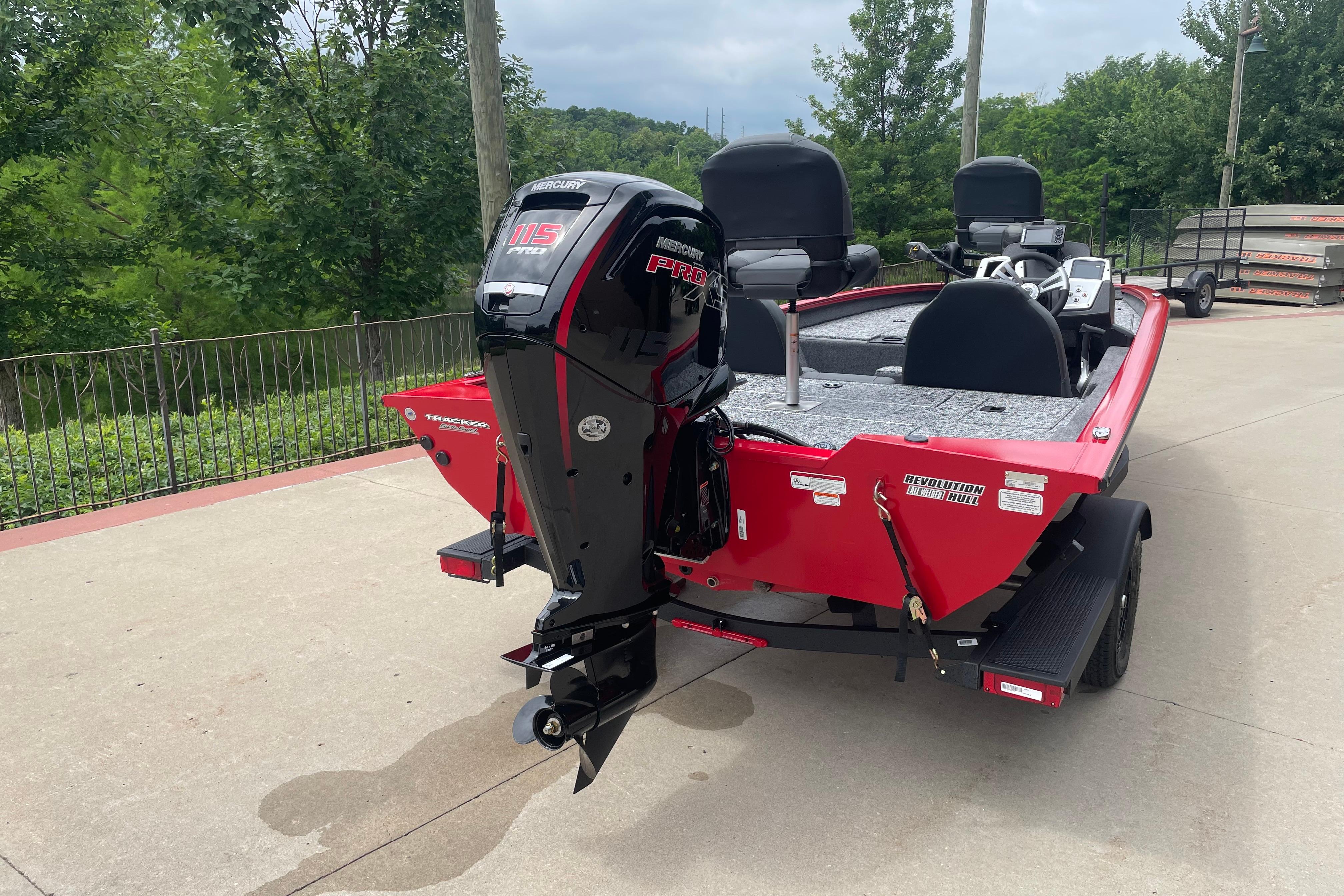 2026 Tracker Pro Team 190 boat with Mercury 115 Pro XS engine, parked outdoors.