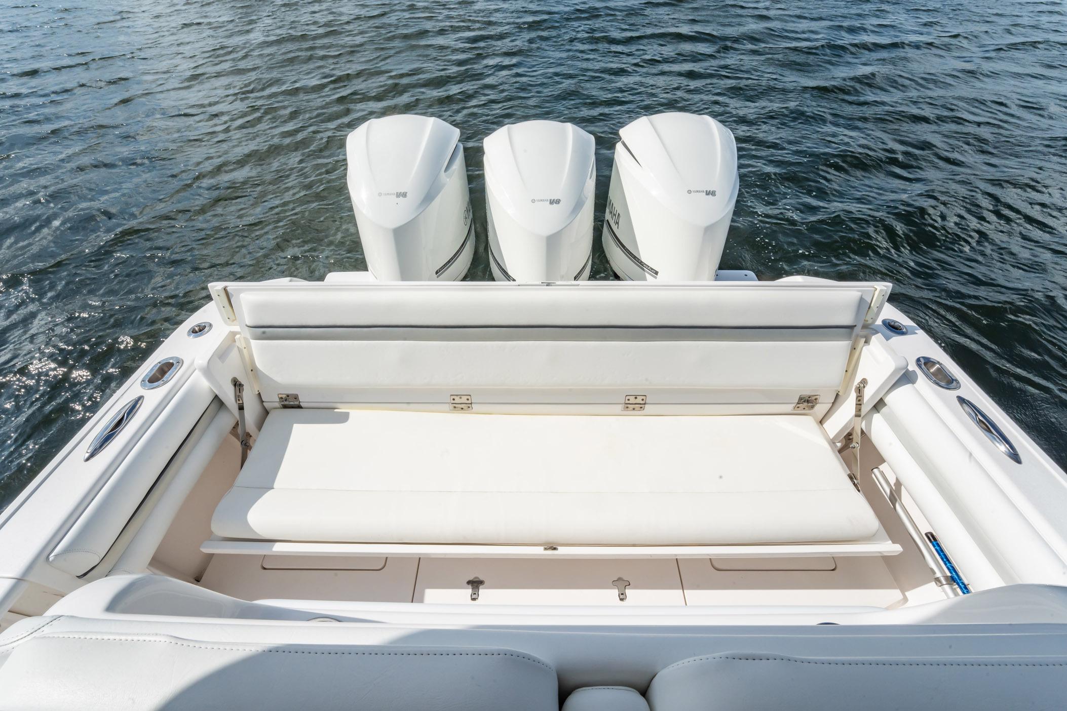 2015 Intrepid 375 Center Console boat with triple outboard engines on water.