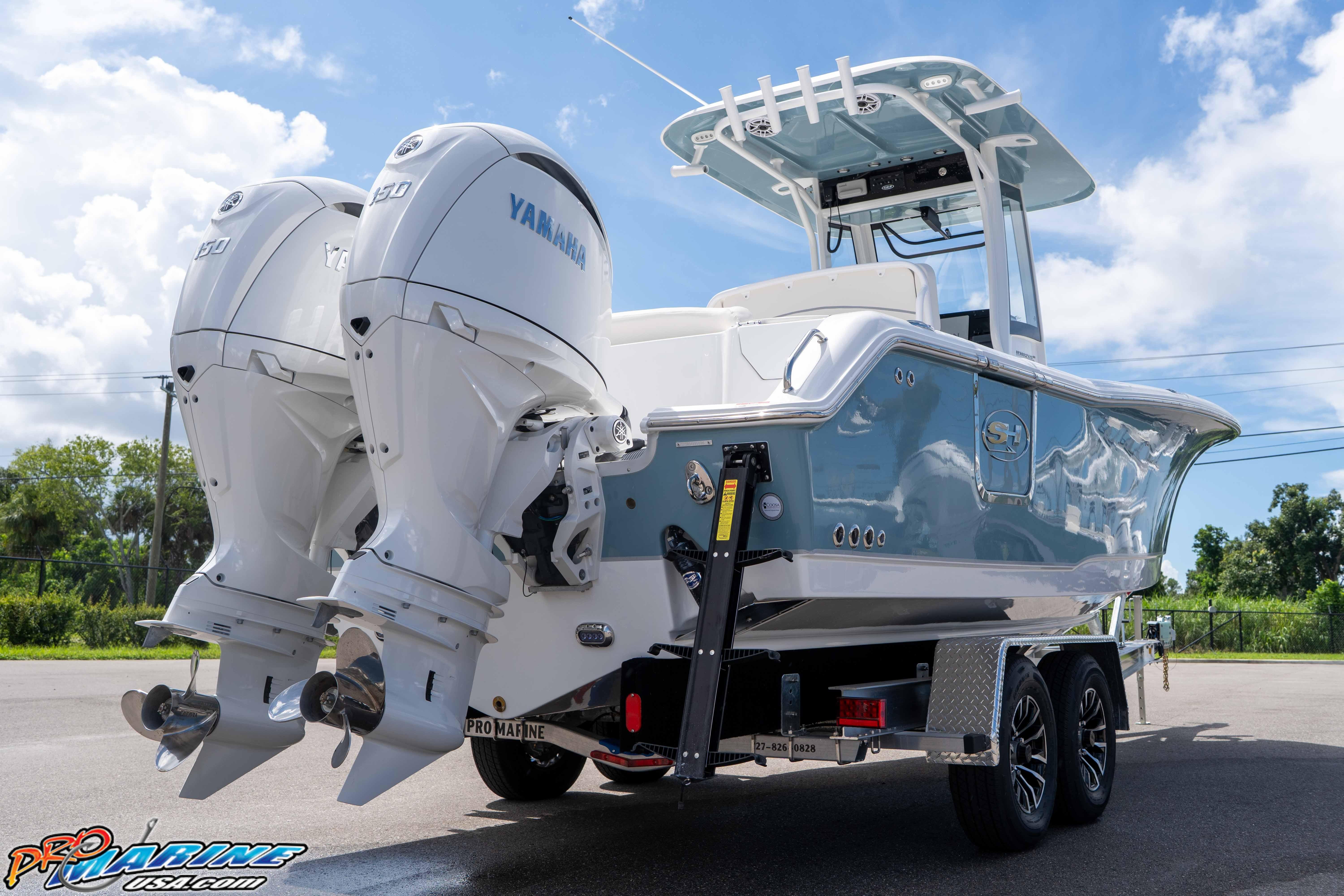 2026 Sea Hunt Ultra 265 SE boat with dual Yamaha engines on a trailer.