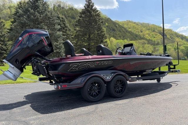 2026 Nitro Z21 XL Pro boat on trailer, parked outdoors with scenic background.