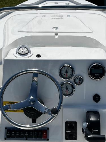 2024 Key West 188 Bay Reef boat dashboard with steering wheel and gauges.