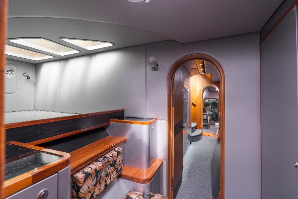 Luxurious interior of 2025 Shuttleworth 52 AeroRig yacht with modern design and wood accents.