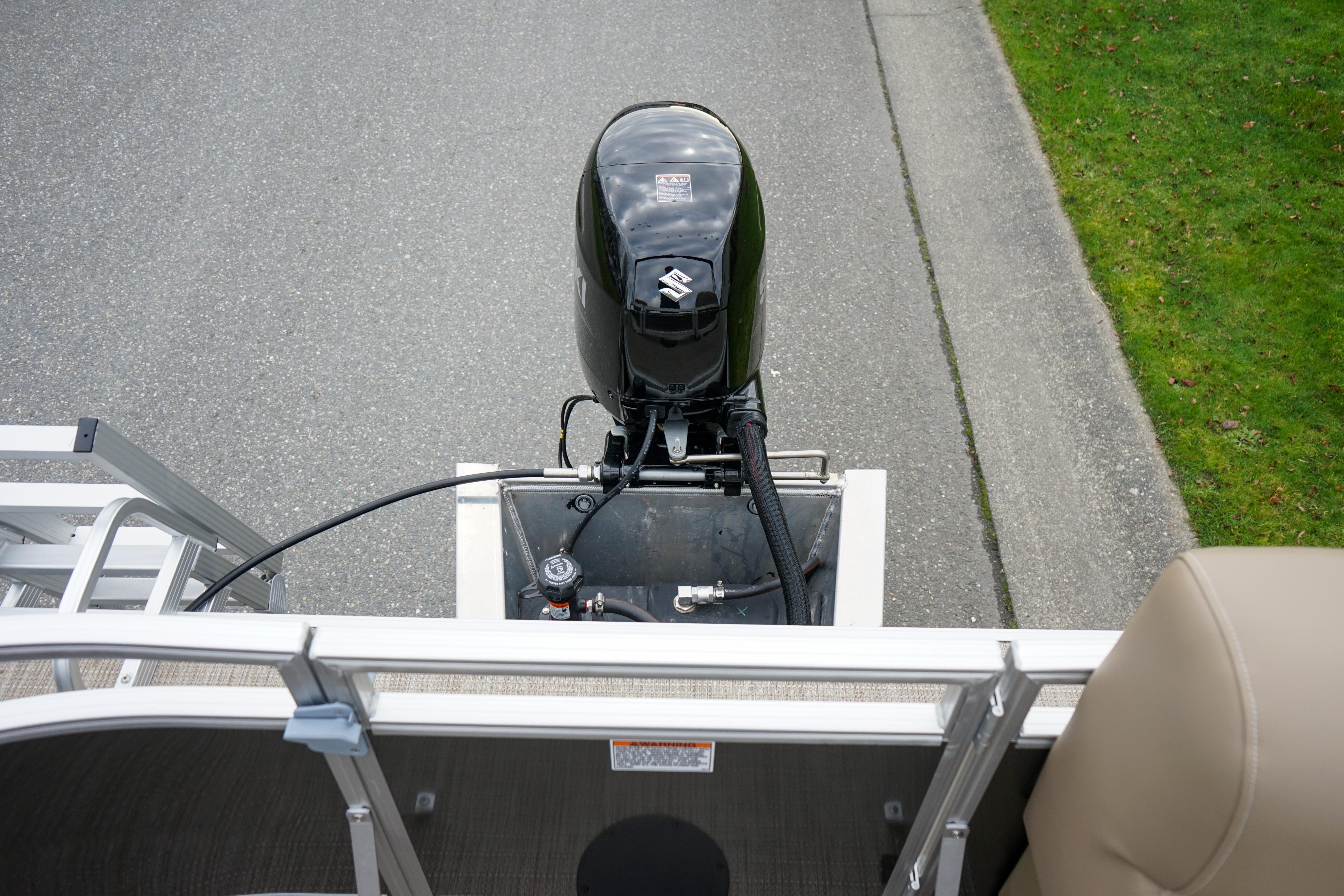 2025 Starcraft LX16R boat with outboard motor on a paved road.