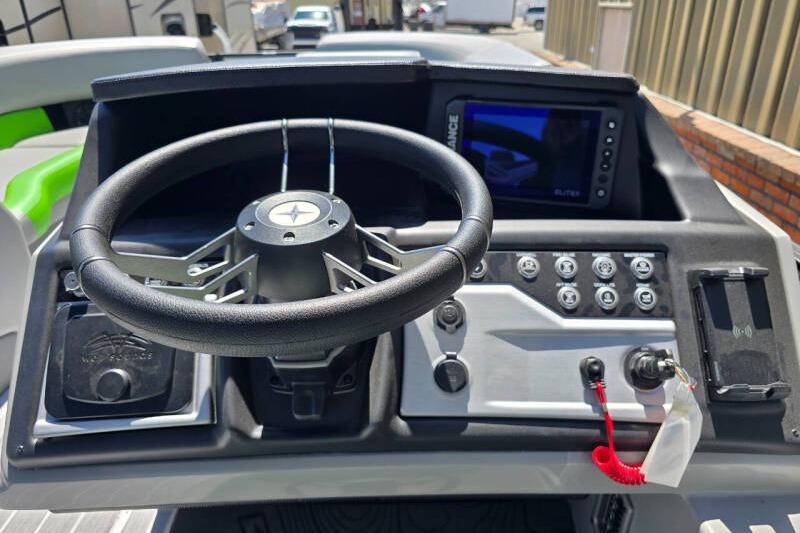 Steering console of 2026 Berkshire STS Arch Performance Series boat with modern controls.