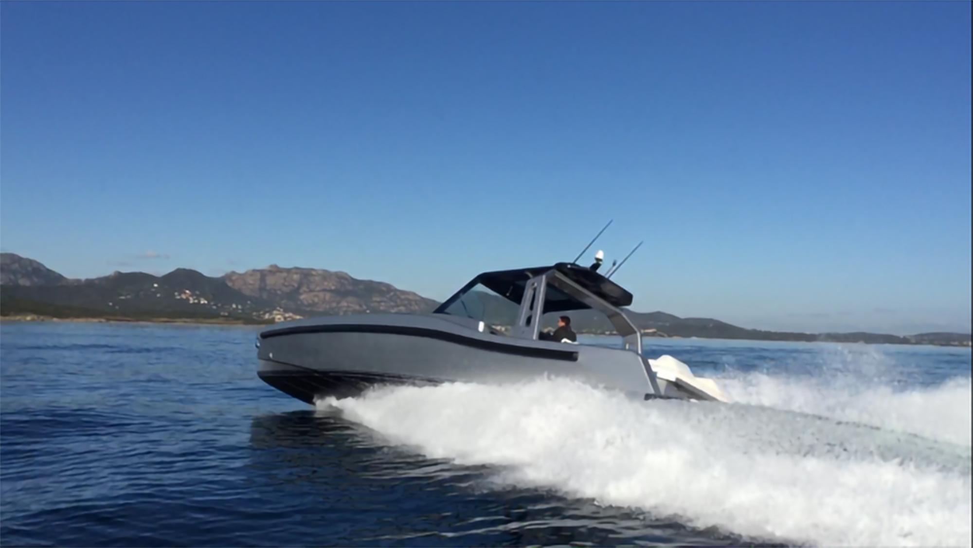 2017 Maori 50 boat cruising on open water with mountains in the background.
