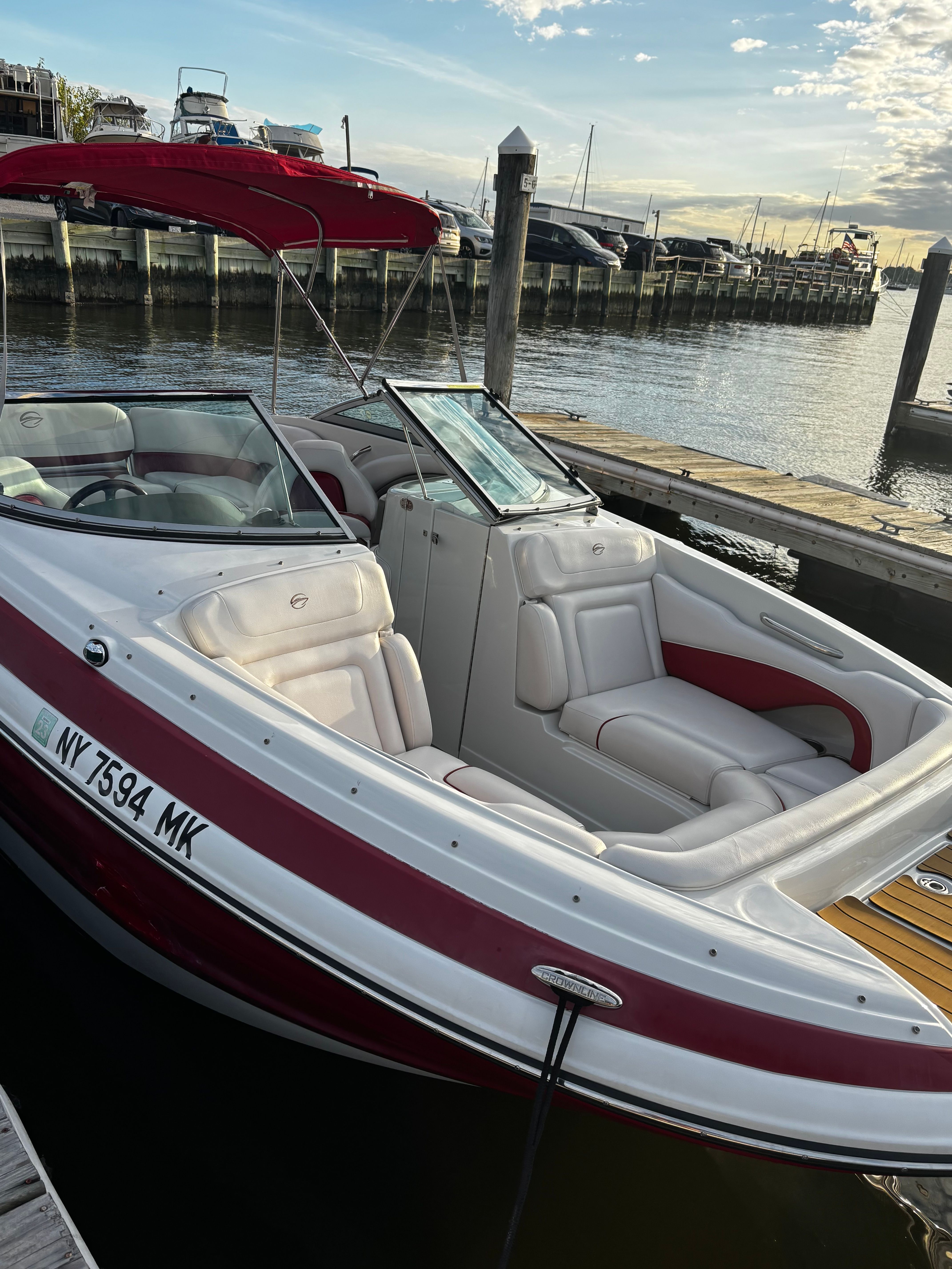 2014 Crownline Eclipse E2 boat docked at sunset.