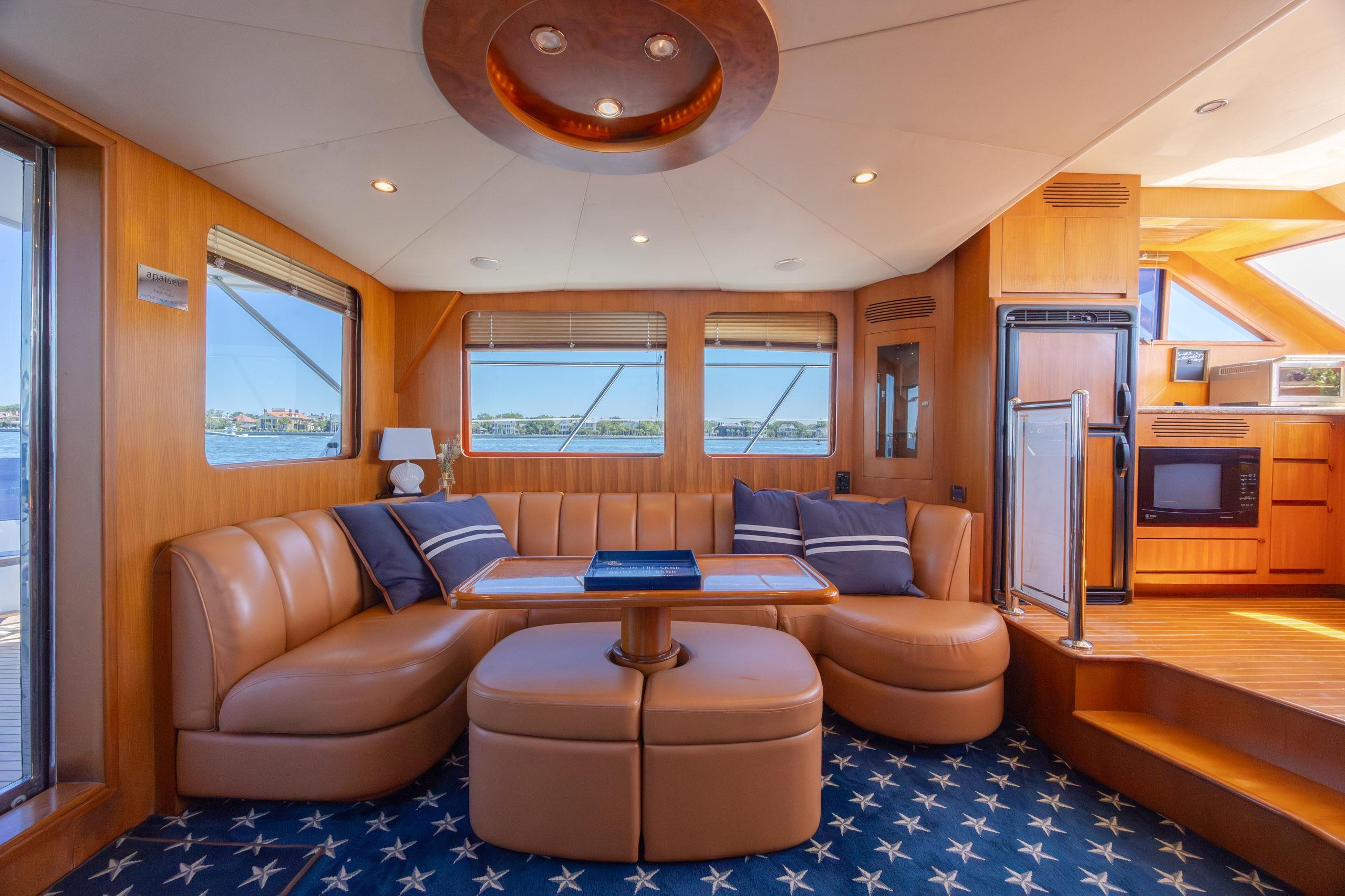 Luxurious interior of a 2005 Ocean Alexander 52 Sedan yacht with elegant seating and modern amenities.