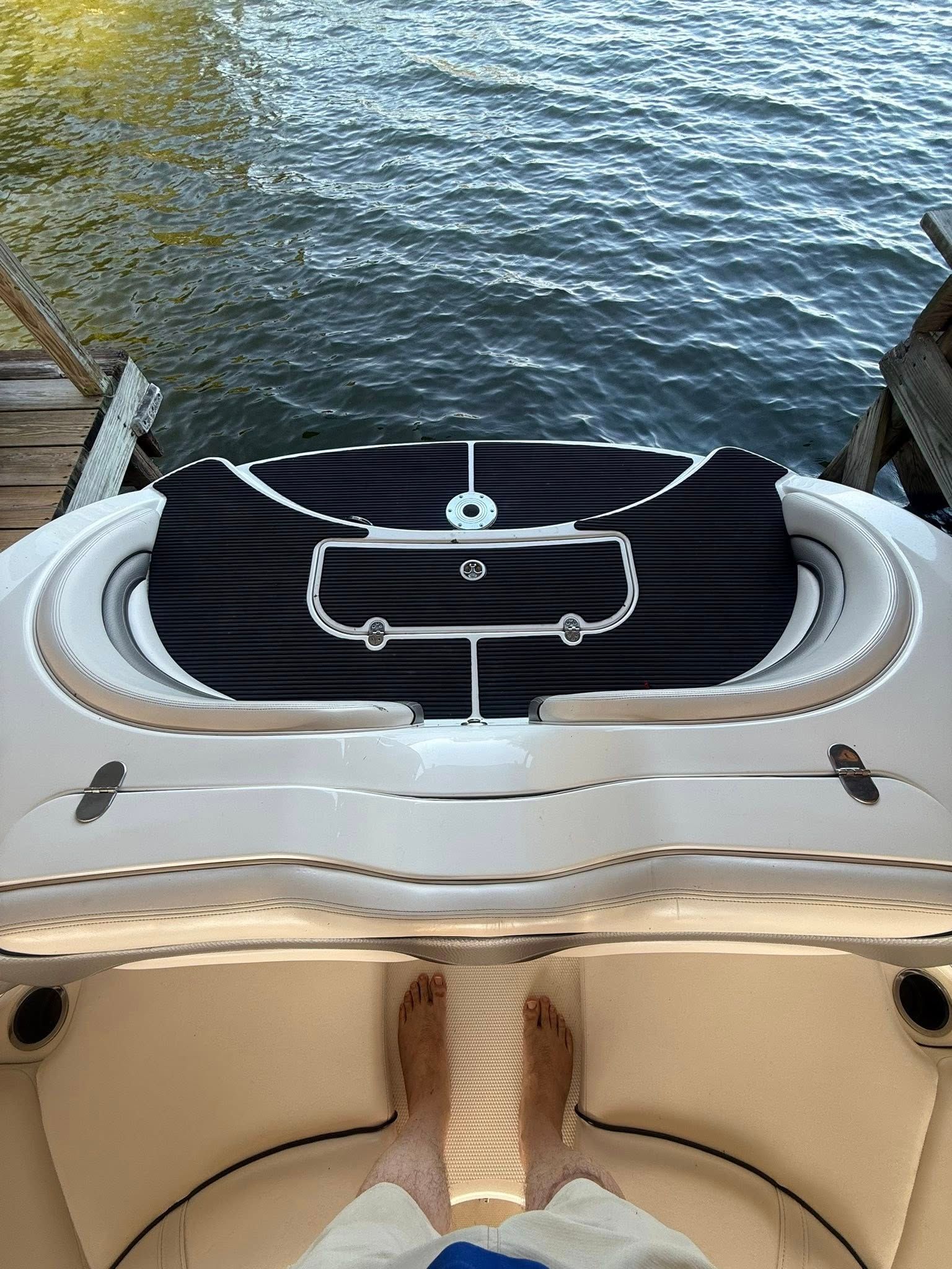 2008 Yamaha 212X boat on water with dock.