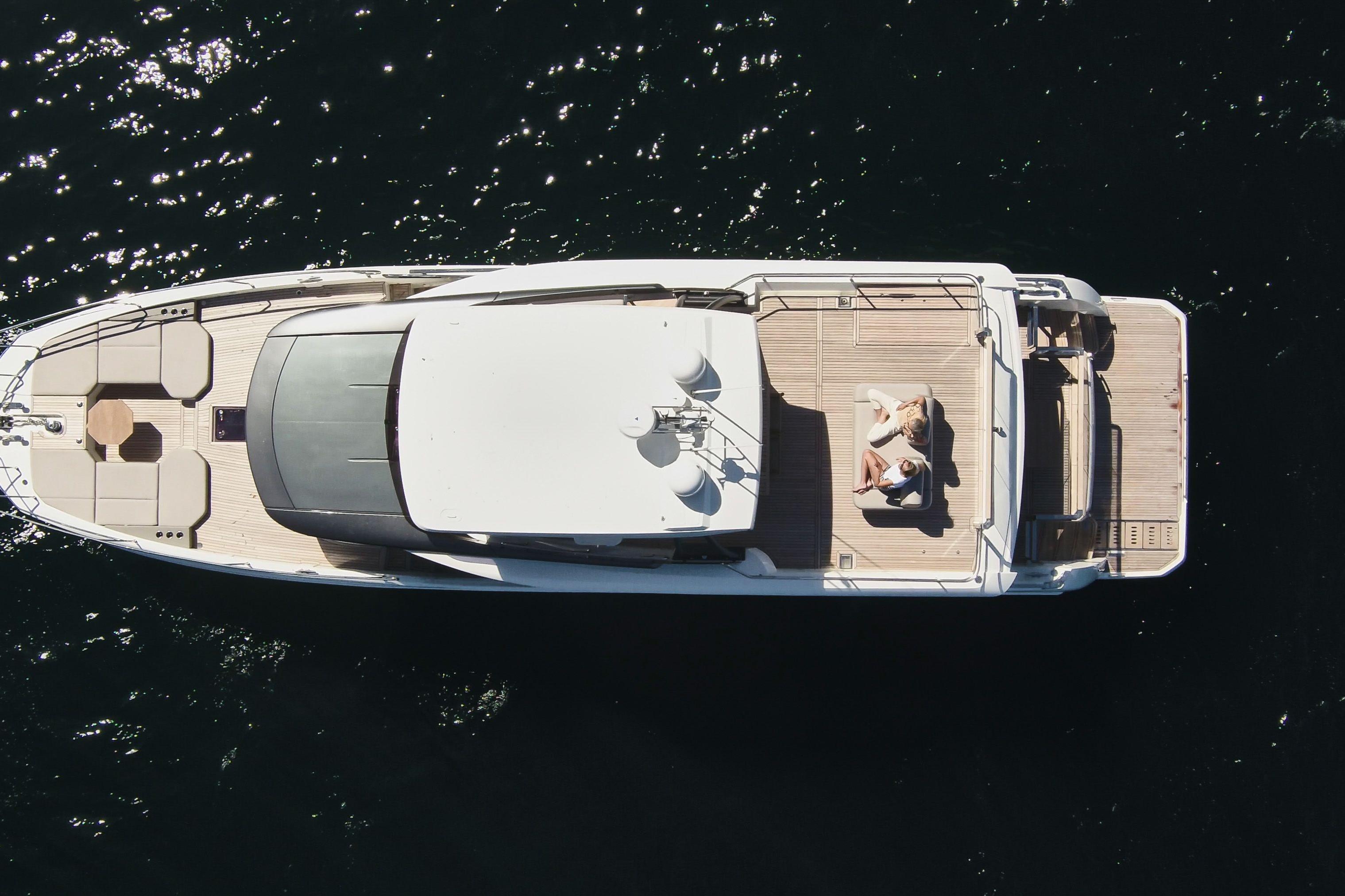Aerial view of 2026 Prestige X60 yacht on open water, featuring spacious deck and seating area.