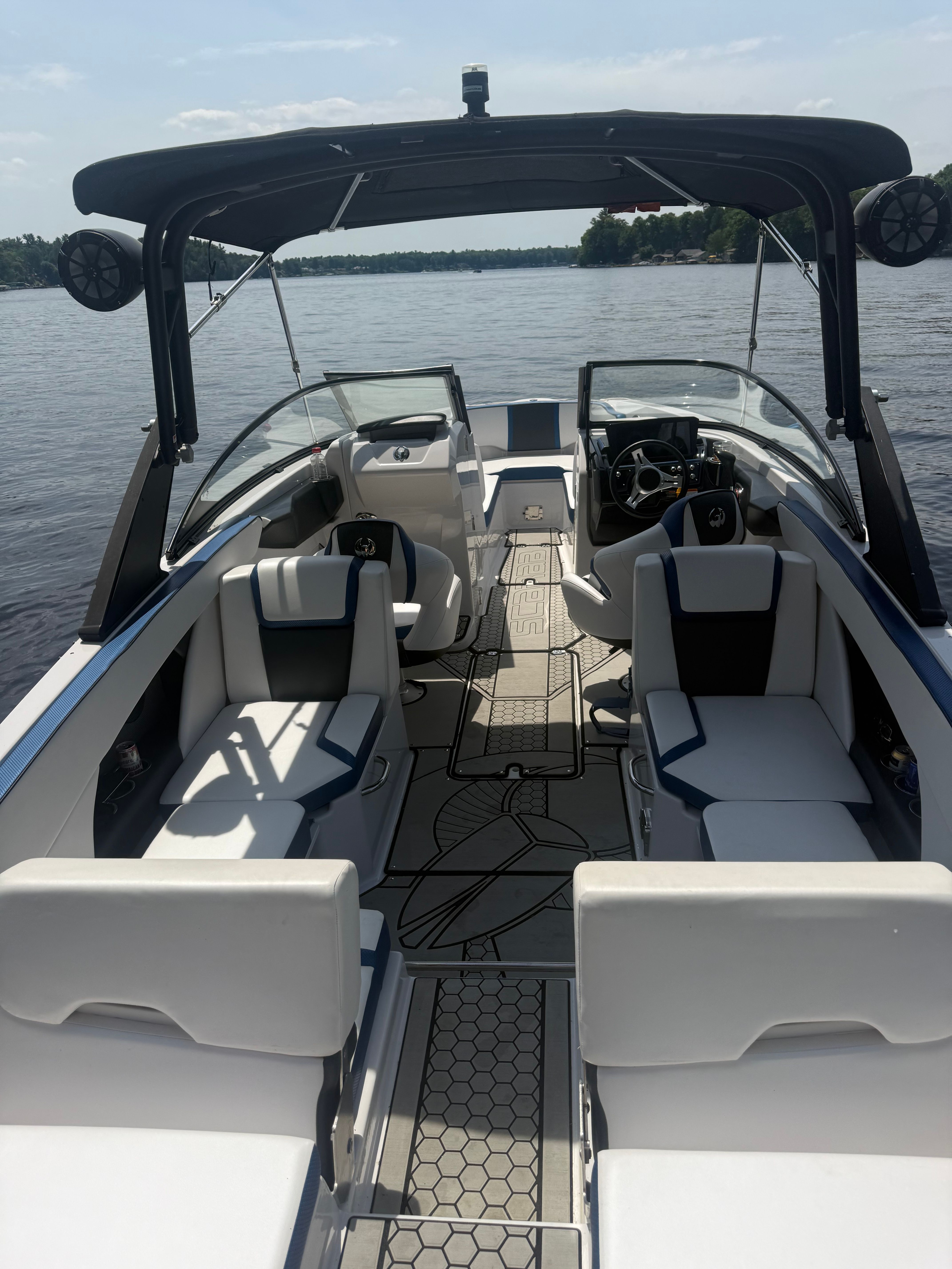 2018 Scarab 255 HOI on calm water with stylish interior and modern design.