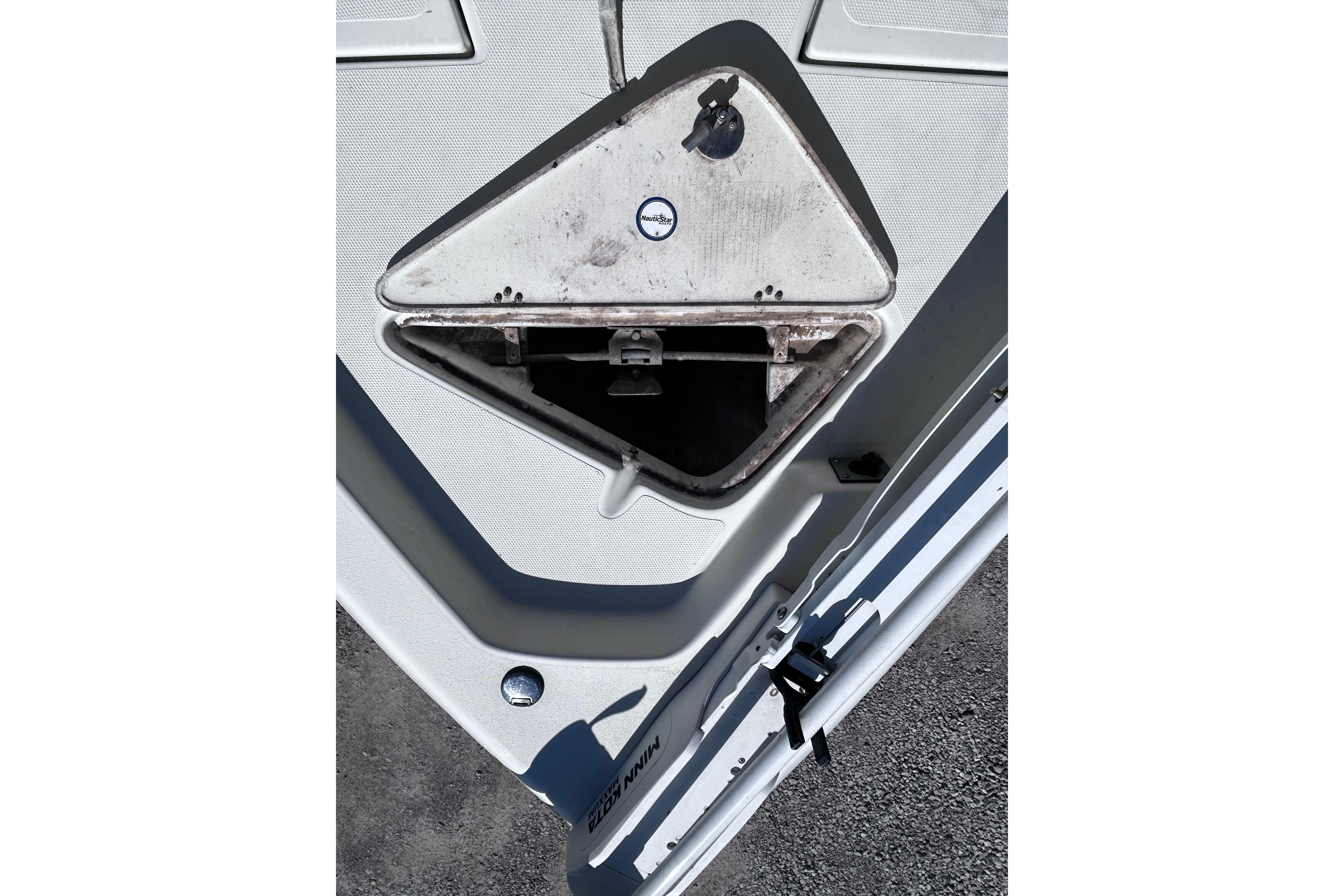 2016 NauticStar 1810 NauticBay boat anchor compartment, open and empty.