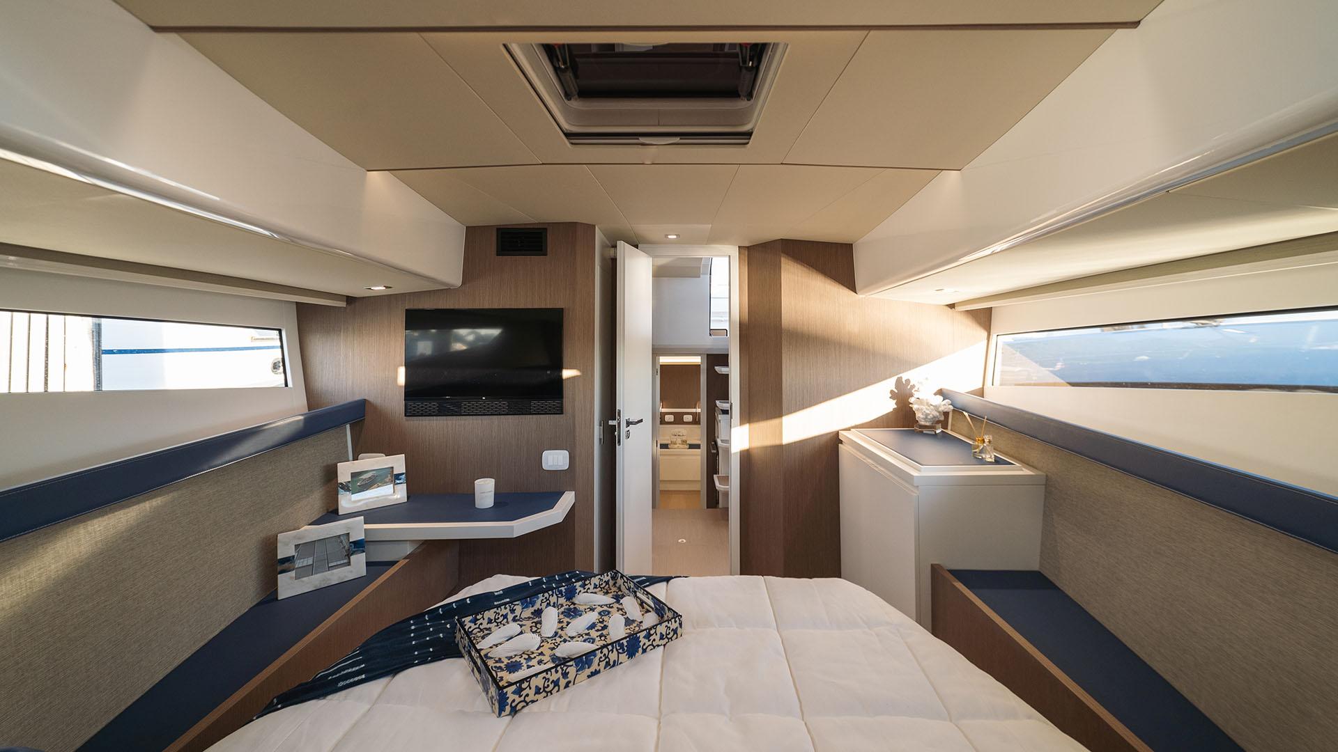 Luxurious interior of the 2025 Fiart 43 Seawalker yacht cabin.