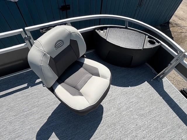 2026 Sun Tracker Bass Buggy 18 DLX boat seat with gray upholstery and railing.
