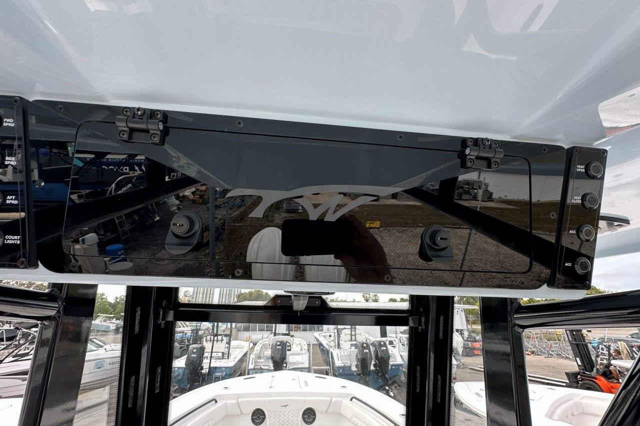 2026 Tidewater 272 LXF boat dashboard with control panel and switches.