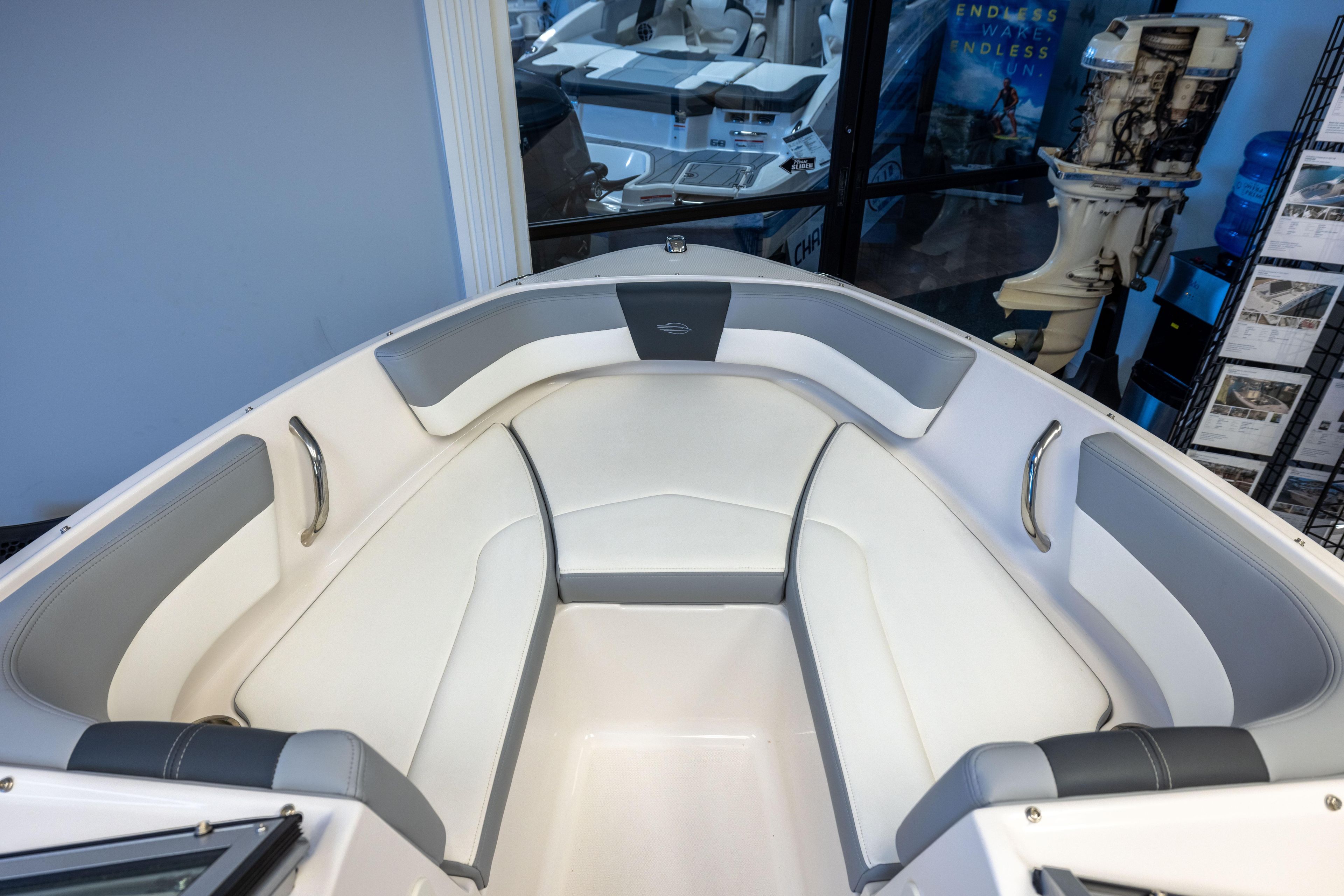 2024 Chaparral 19 SSi OB boat interior with white and gray seating.