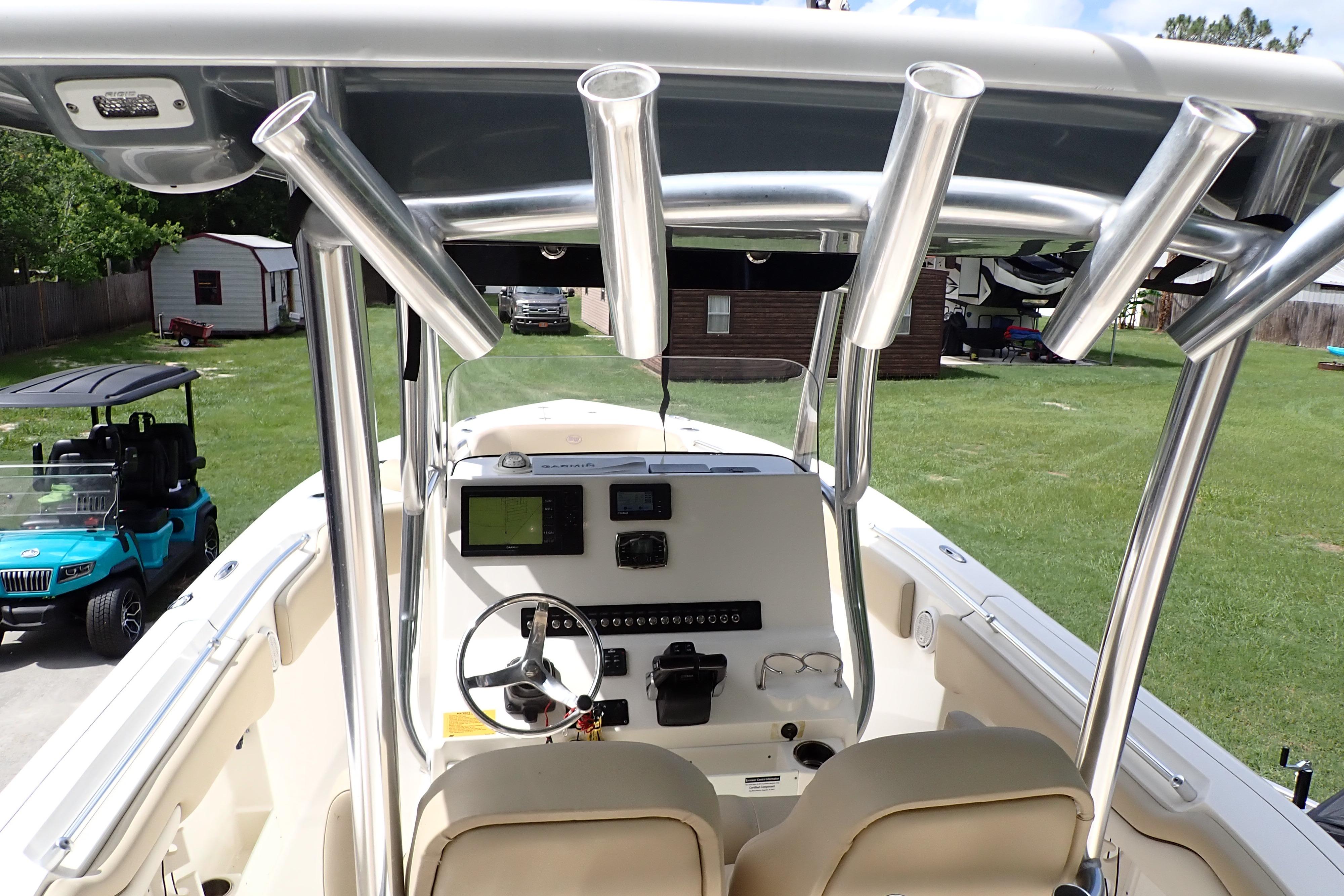 2019 Key West 263 FS boat interior with steering console and rod holders.