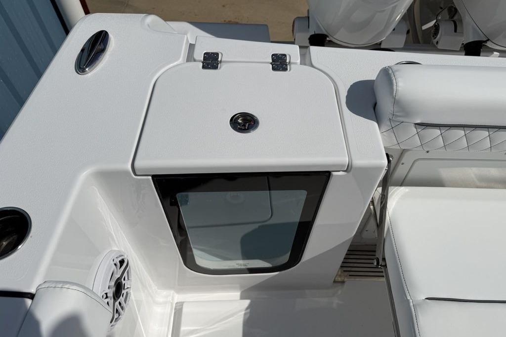 2026 Sportsman Open 252 Center Console boat interior with seating and storage compartment.