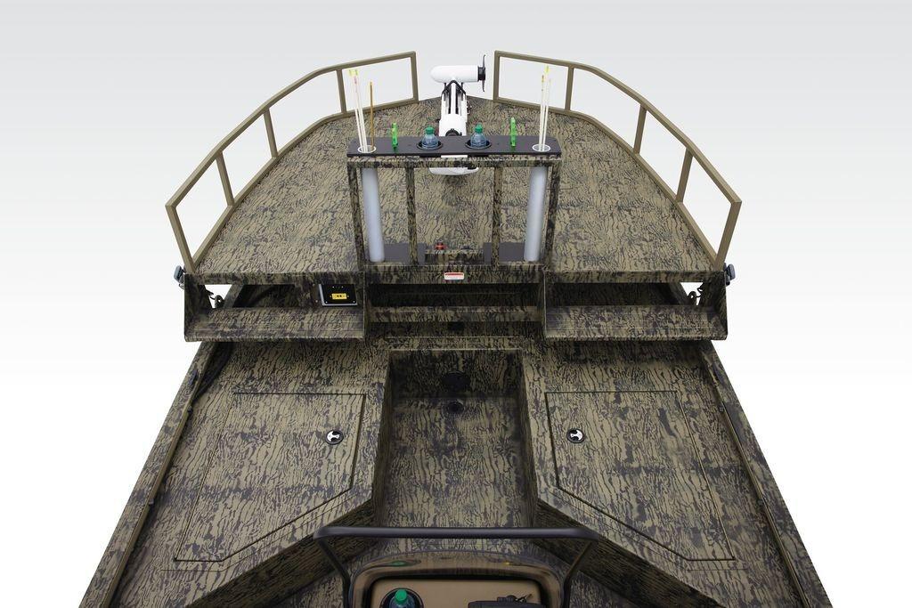 2026 Tracker GRIZZLY® 2072 CC Sportsman boat, camo design, spacious deck, and railing.