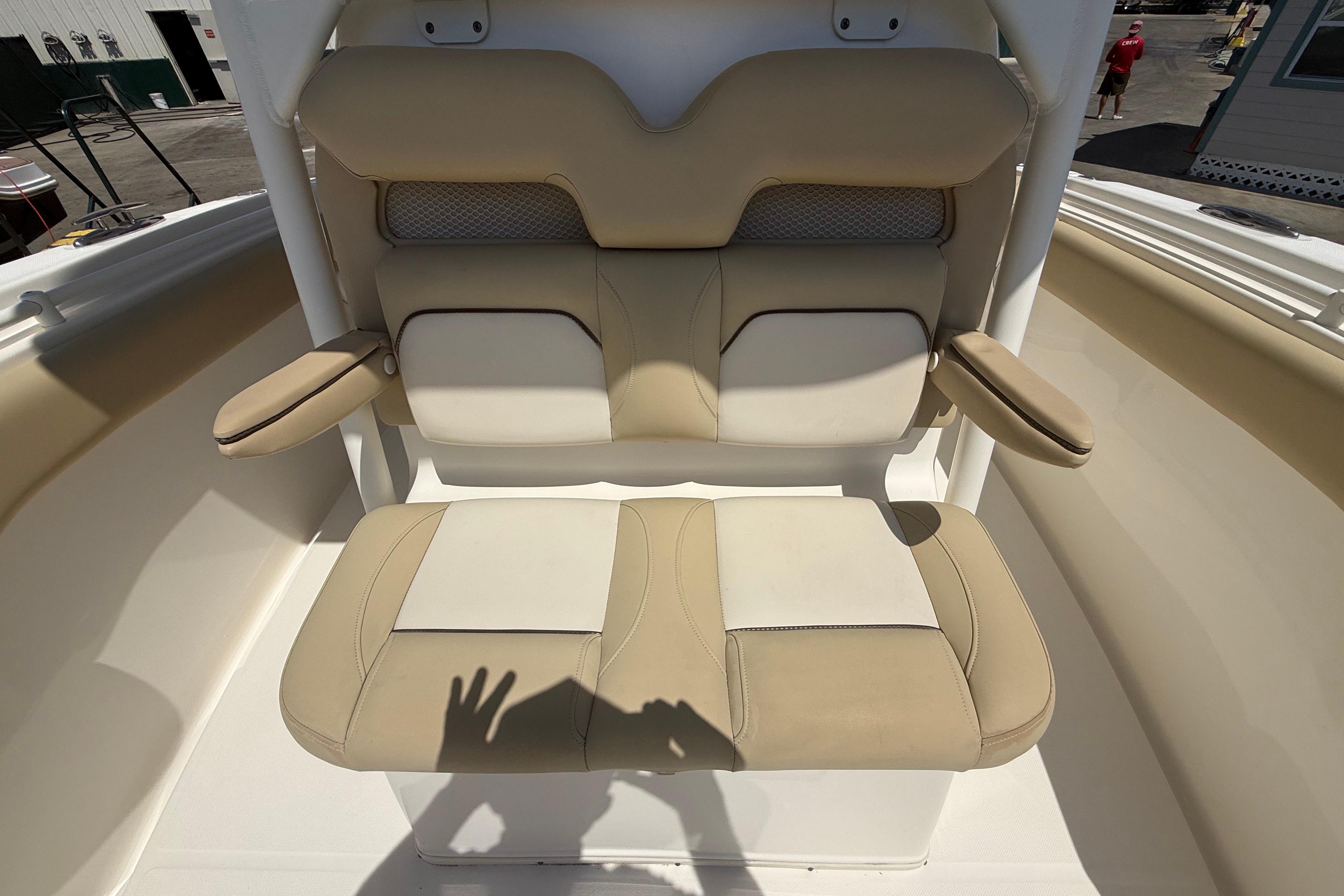 2019 Key West Billistic 281 Center Console boat seat with beige and white upholstery.