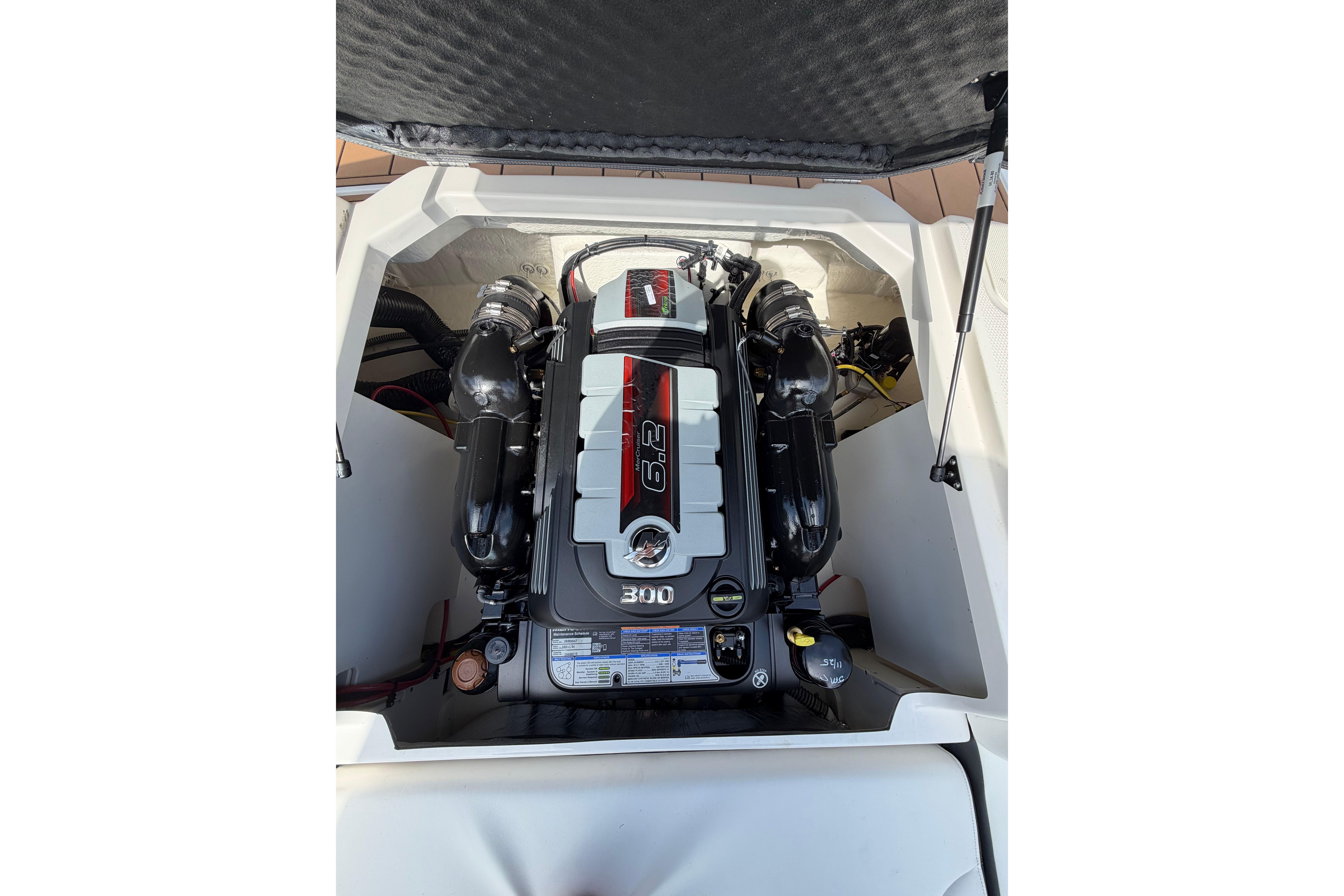 2025 Chaparral 230 SSi boat engine compartment with 6.2L 300 HP engine.