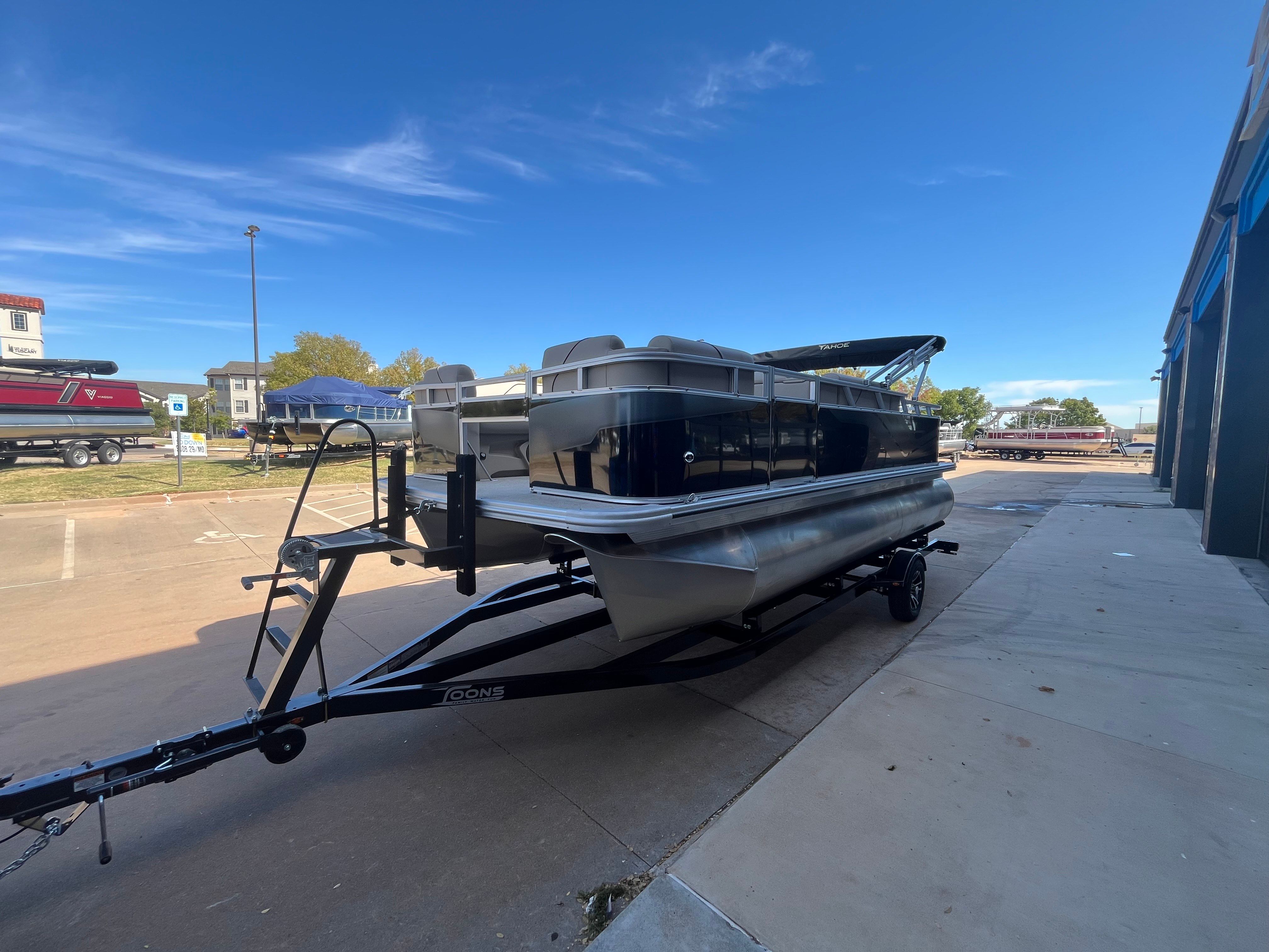 2026 Tahoe 1925 Sport Rear Fish boat on trailer outdoors.