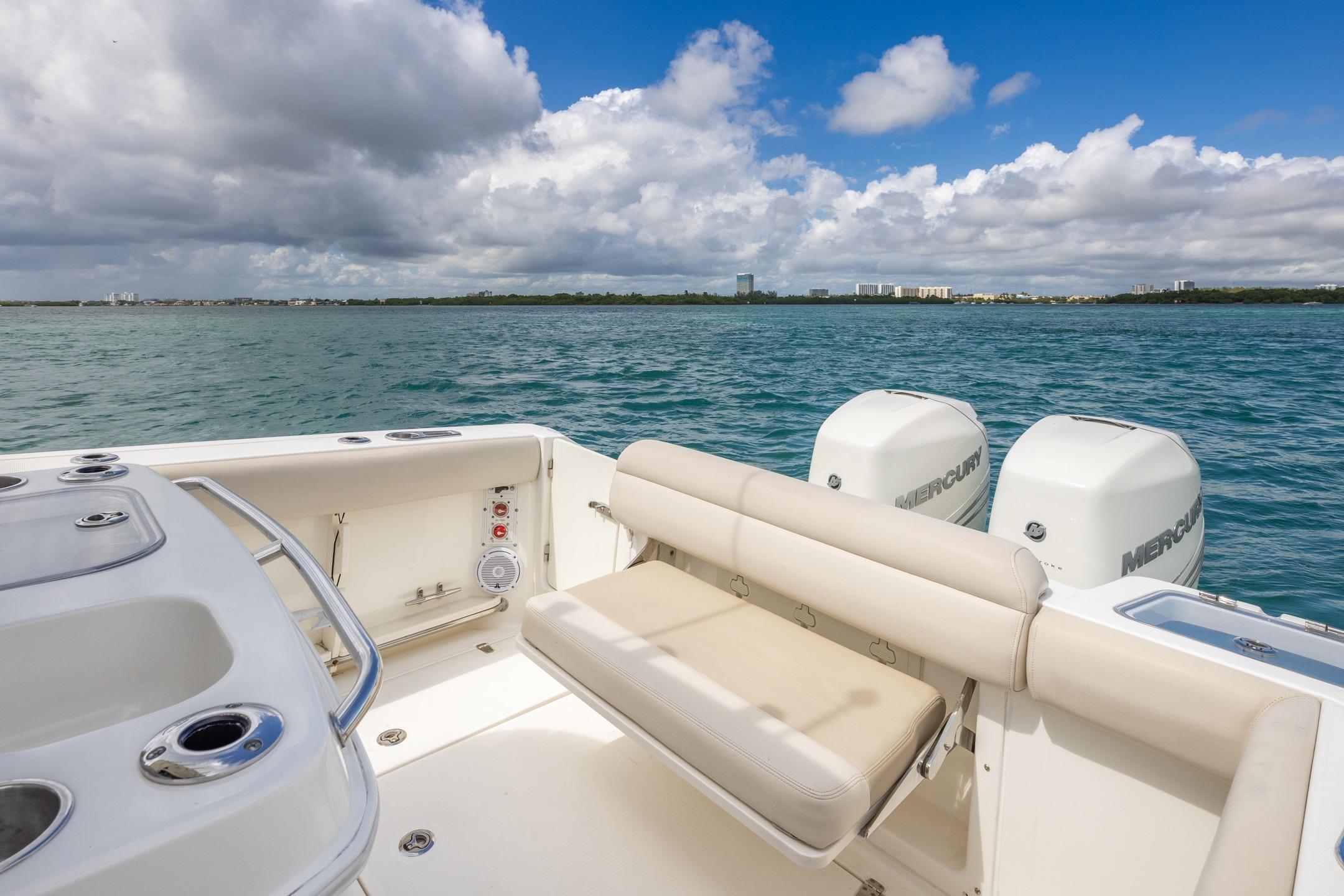 2016 Boston Whaler 280 Outrage boat with twin Mercury engines on open water.