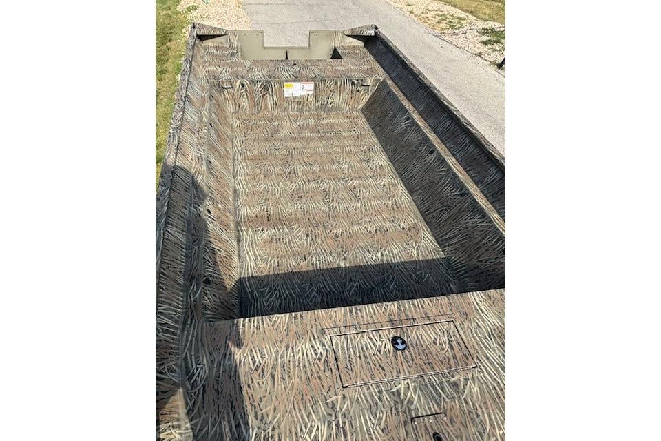 2026 Tracker Grizzly 2072 Utility boat with camouflage interior design.