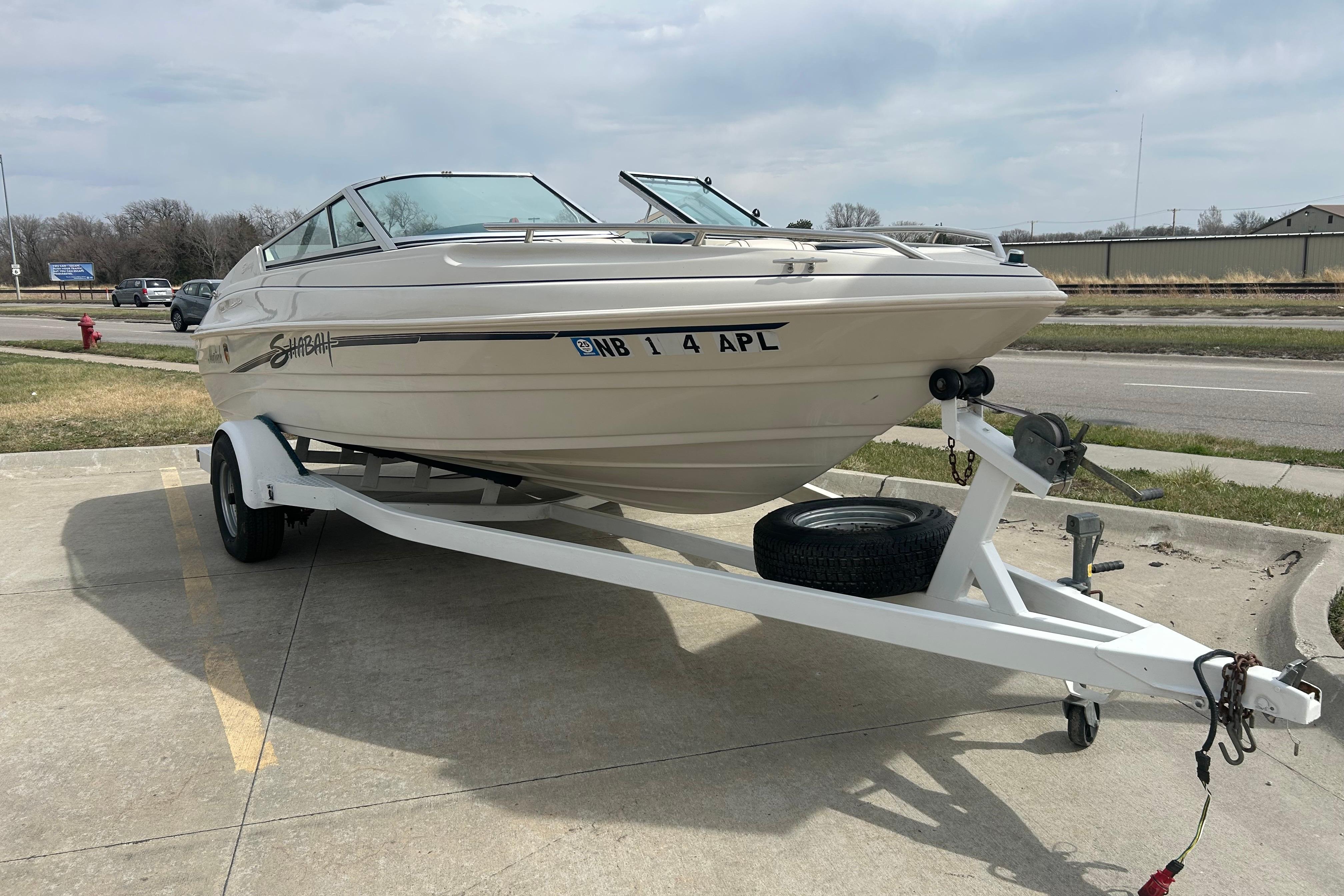 1996 Mariah 180 Shabah boat on trailer in parking lot.