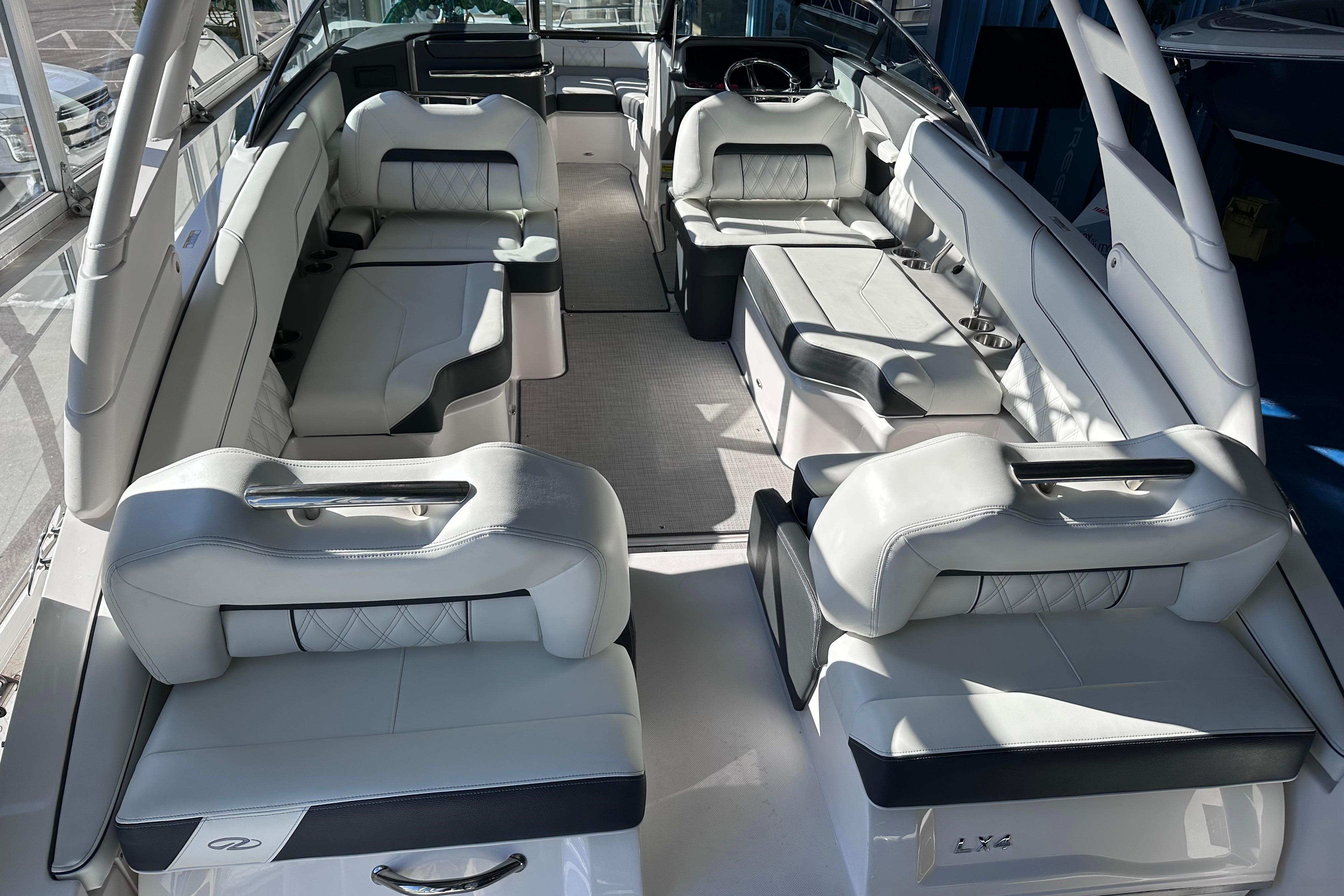 Luxurious interior of 2026 Regal LX4 boat with plush seating and modern design.