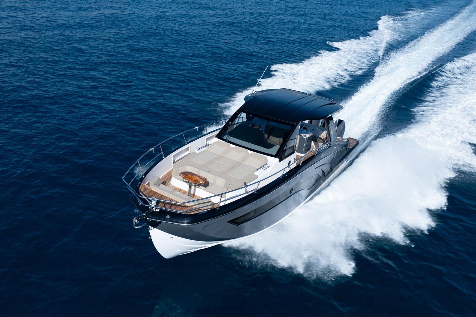 Luxurious 2026 Hanover 447 yacht cruising swiftly on open blue sea.