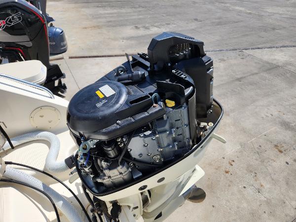 Open outboard motor on a 2005 Pursuit 3070 Offshore Center Console boat.
