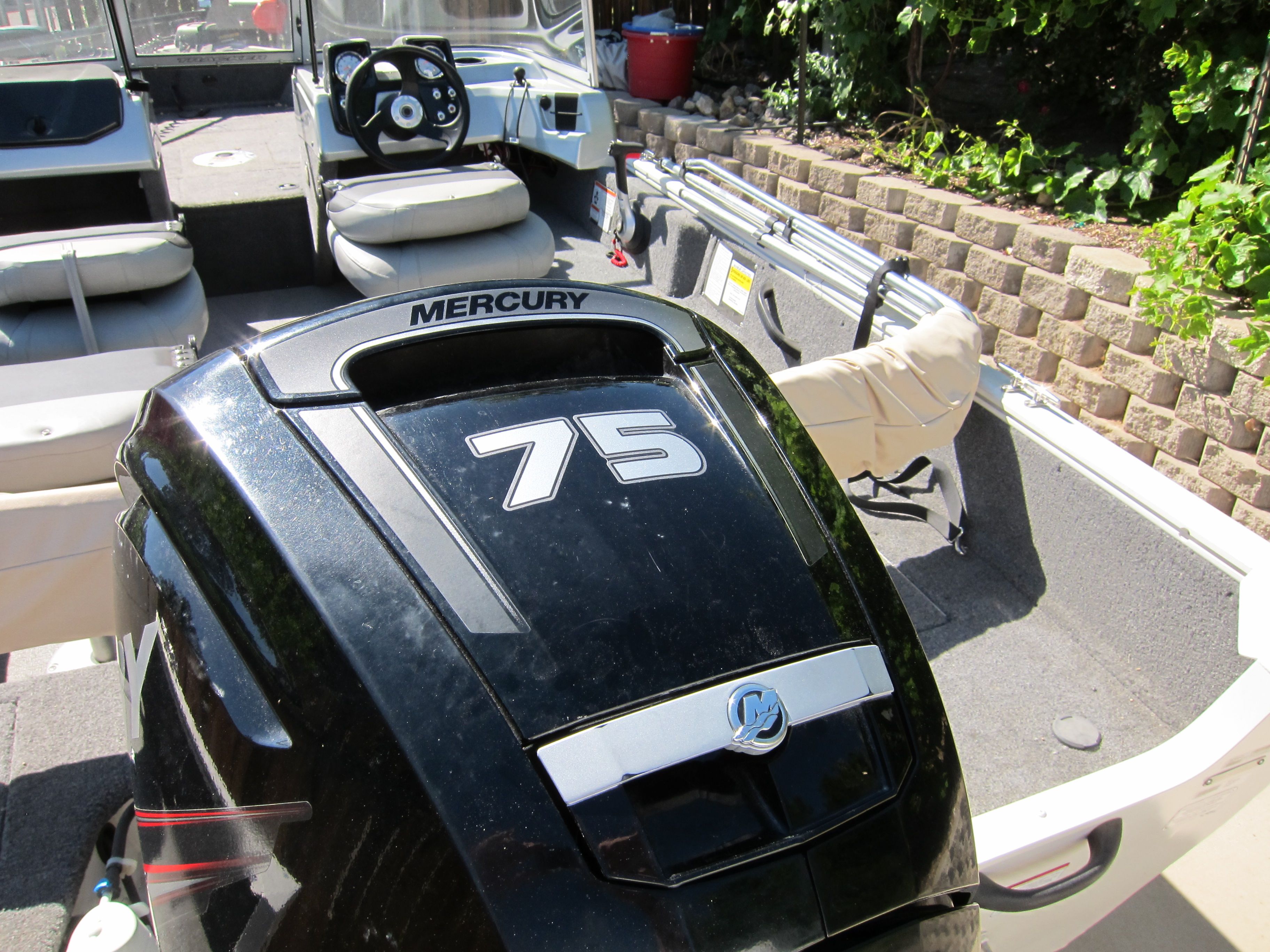 A 2018 Tracker Pro Guide V-16 WT with a Mercury 75 HP outboard motor.