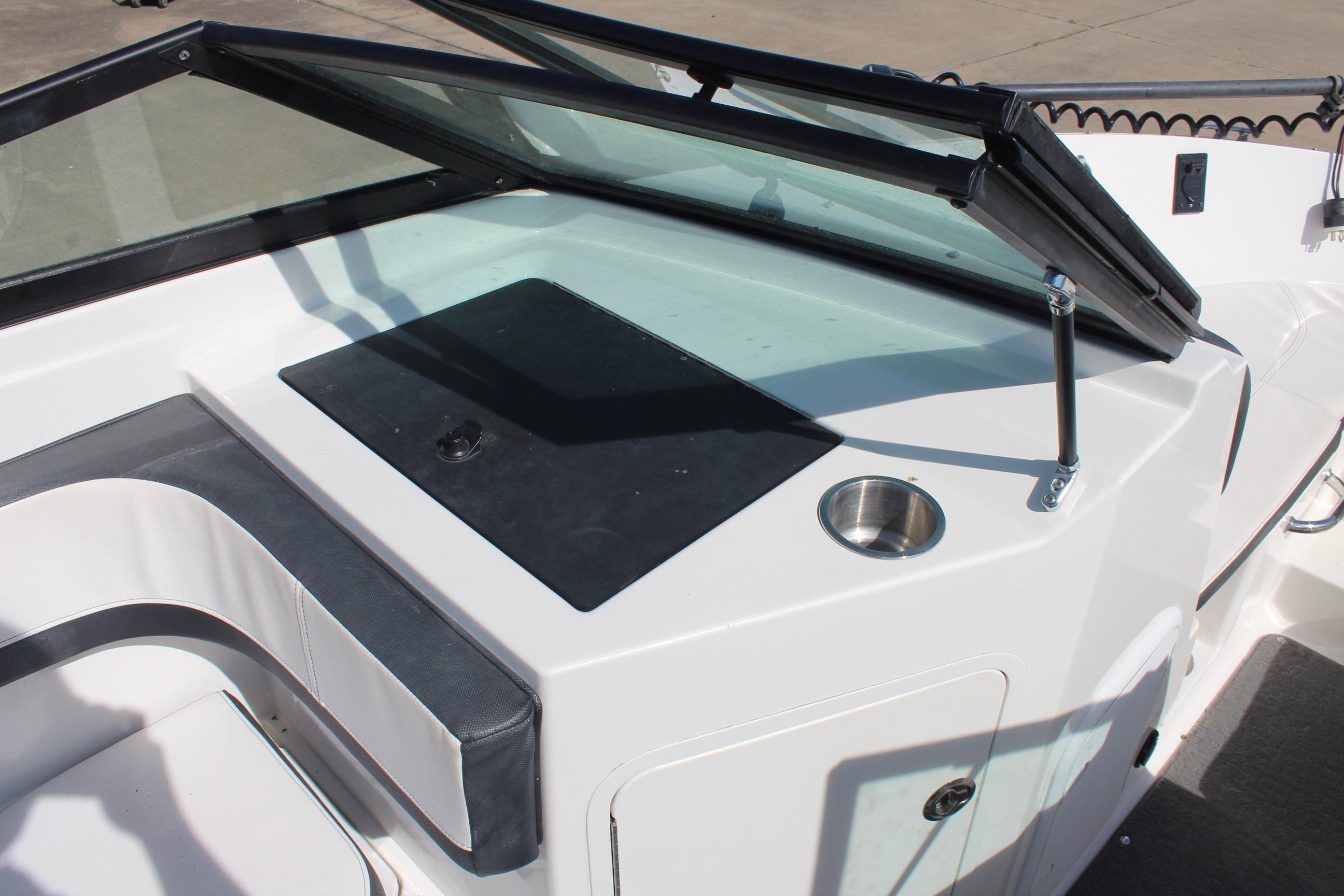 2015 Sea Ray 19 SPX OB boat dashboard with windshield and cup holder.