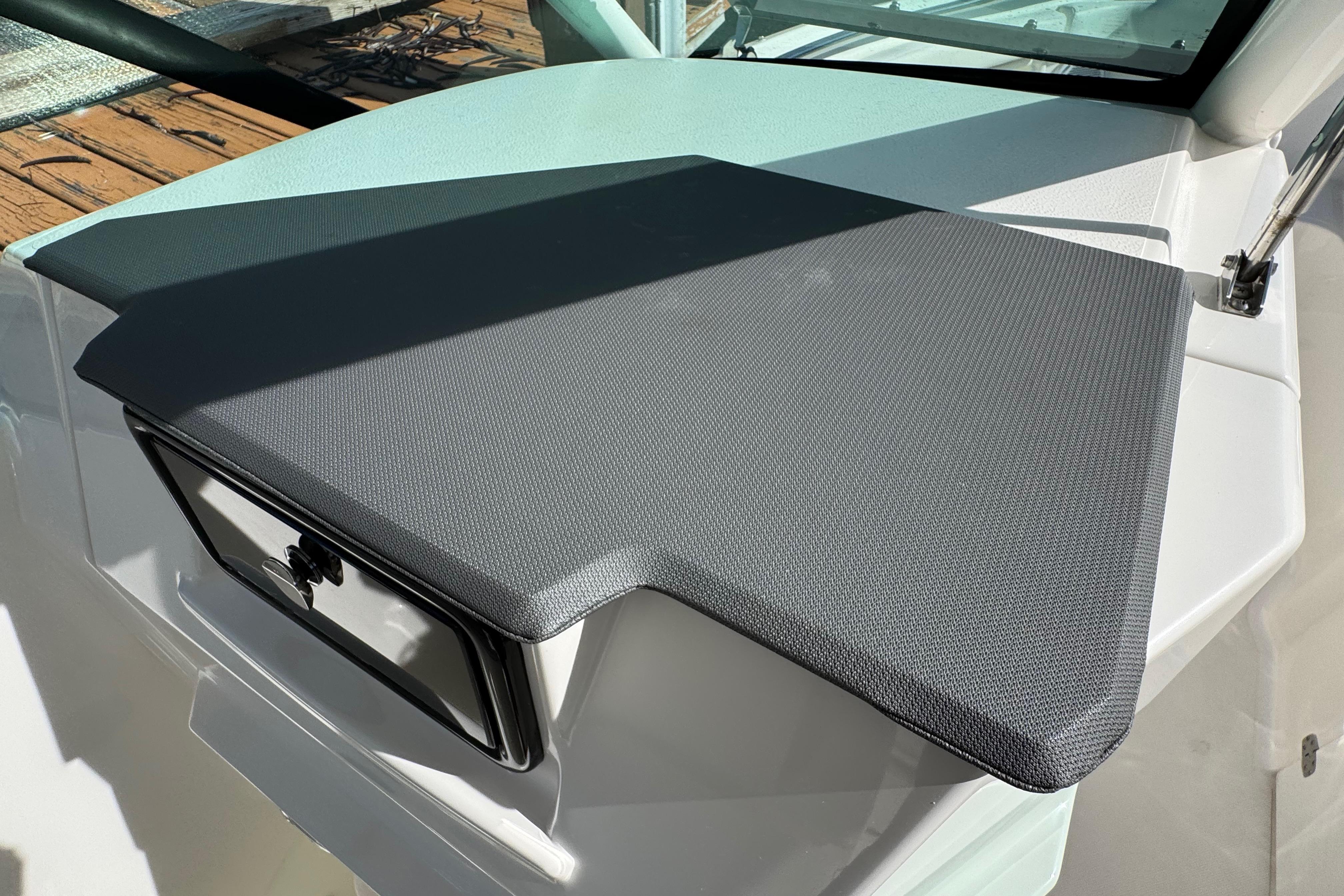 2022 Pursuit DC 266 Dual Console boat dashboard with textured cover.