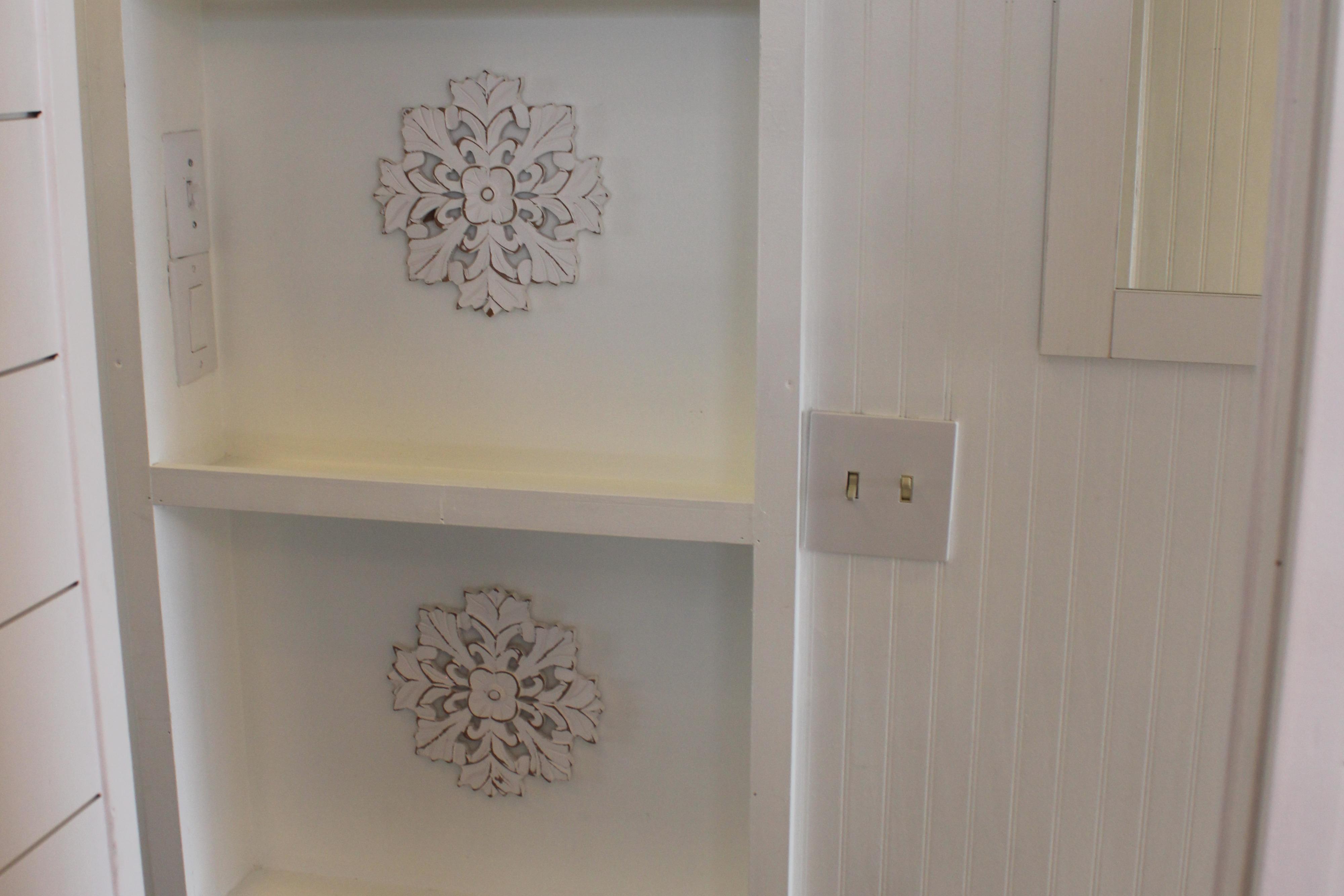 Decorative white wall shelf with ornate floral designs, Sumerset 66, 1992 model.