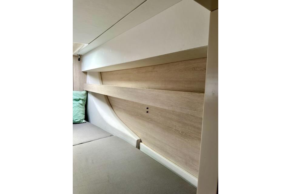 Interior of a 2017 Leopard 40 yacht cabin with modern wood paneling and cushions.