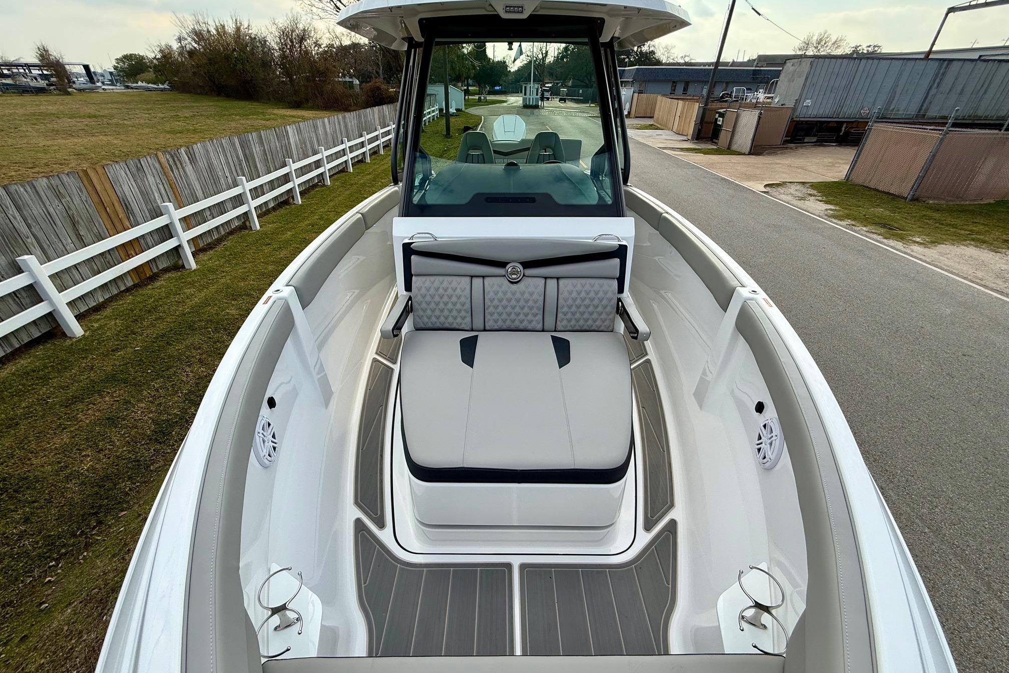 2026 Monterey Elite 25 OB boat interior with cushioned seating and sleek design.
